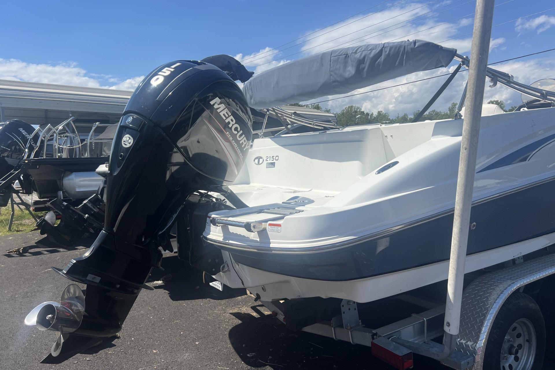 2017 Tahoe 2150 boat with Mercury outboard motor on a trailer.