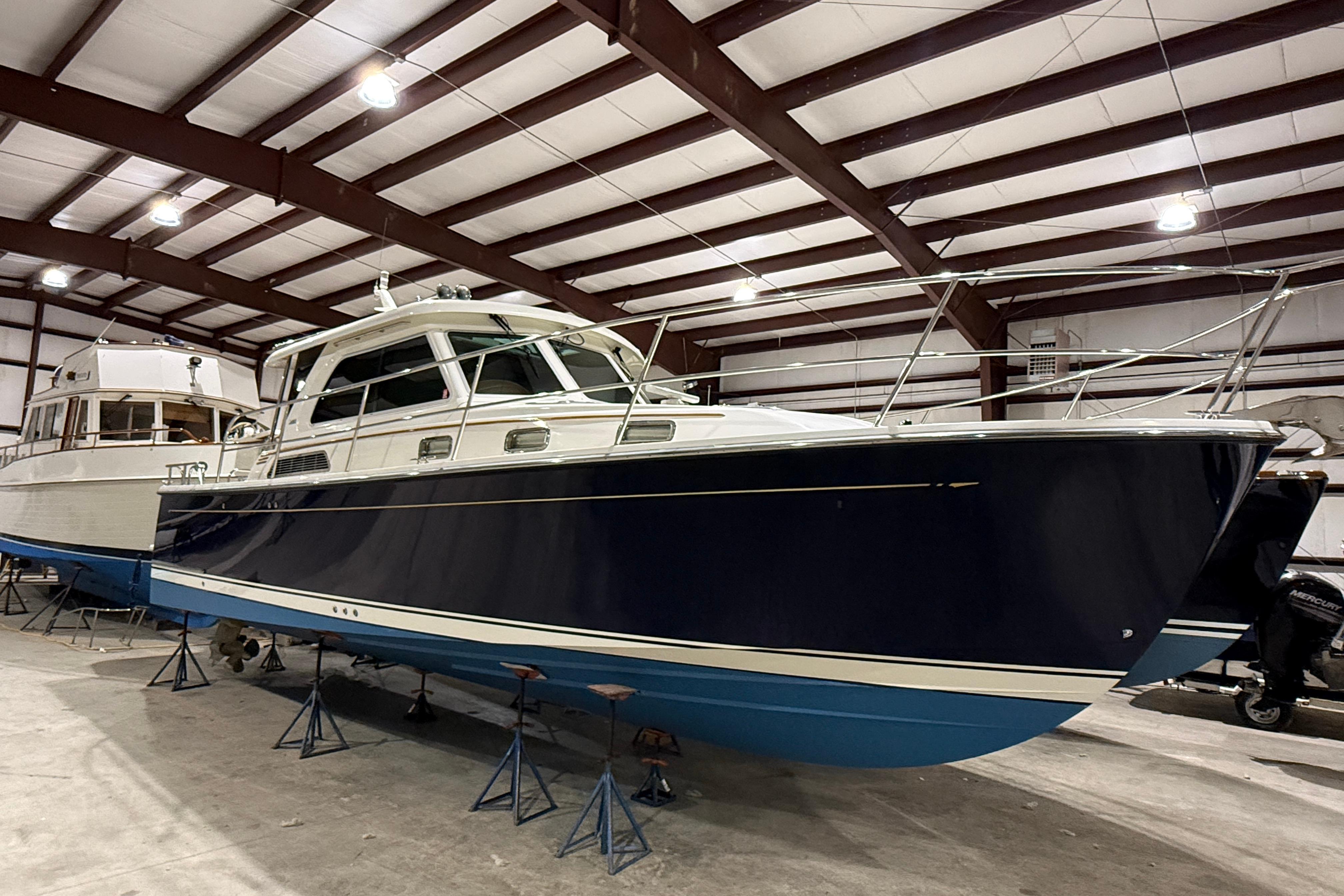 2017 Sabre 38 Salon Express yacht in indoor storage, showcasing sleek design and craftsmanship.
