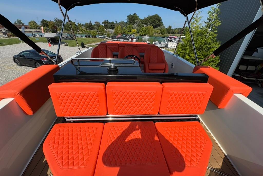 2020 De Antonio Yachts D28 with vibrant orange seating and sleek design.