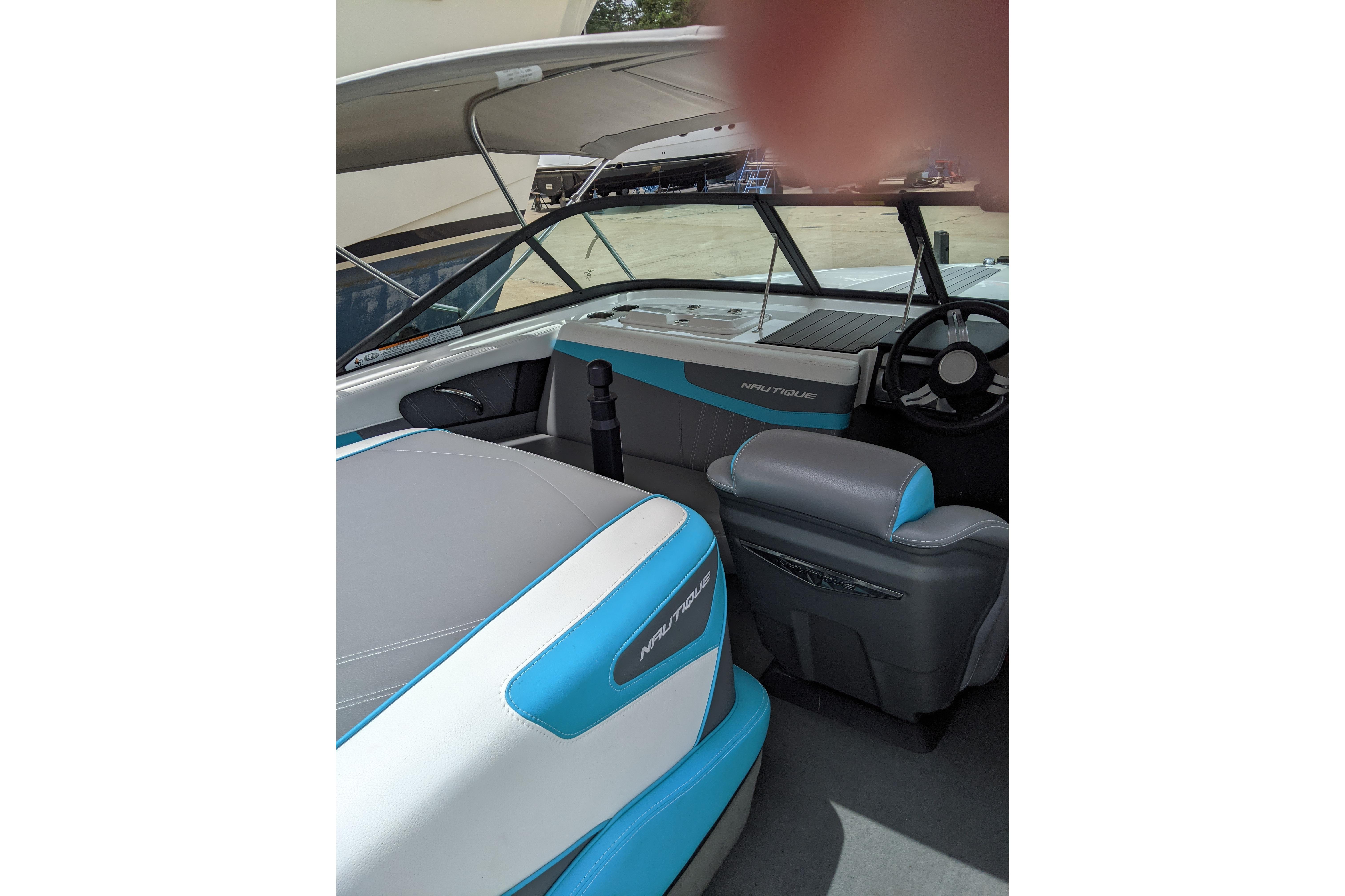 2016 Nautique Ski Nautique 200 Closed Bow interior with blue and gray seating.