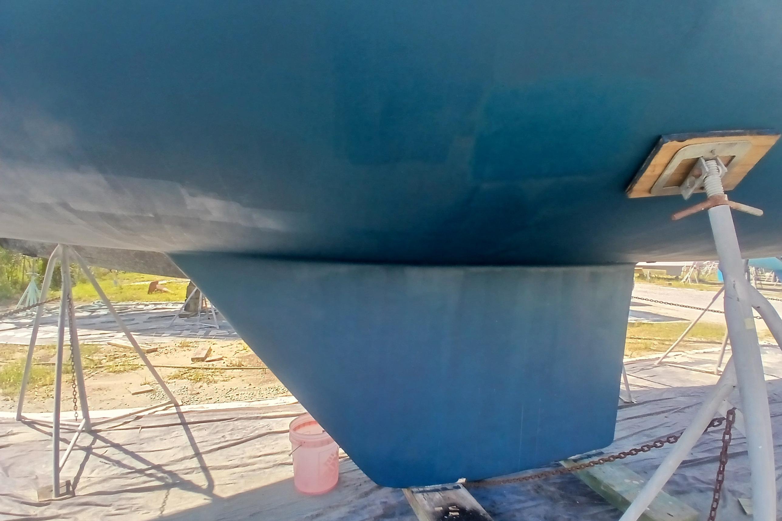 Catalina 42 MkII 1995 sailboat hull and keel on stands, outdoor setting.