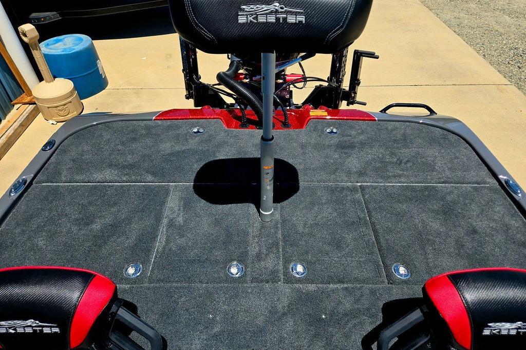 2026 Skeeter ZXE20 boat deck with seating and carpeted surface.