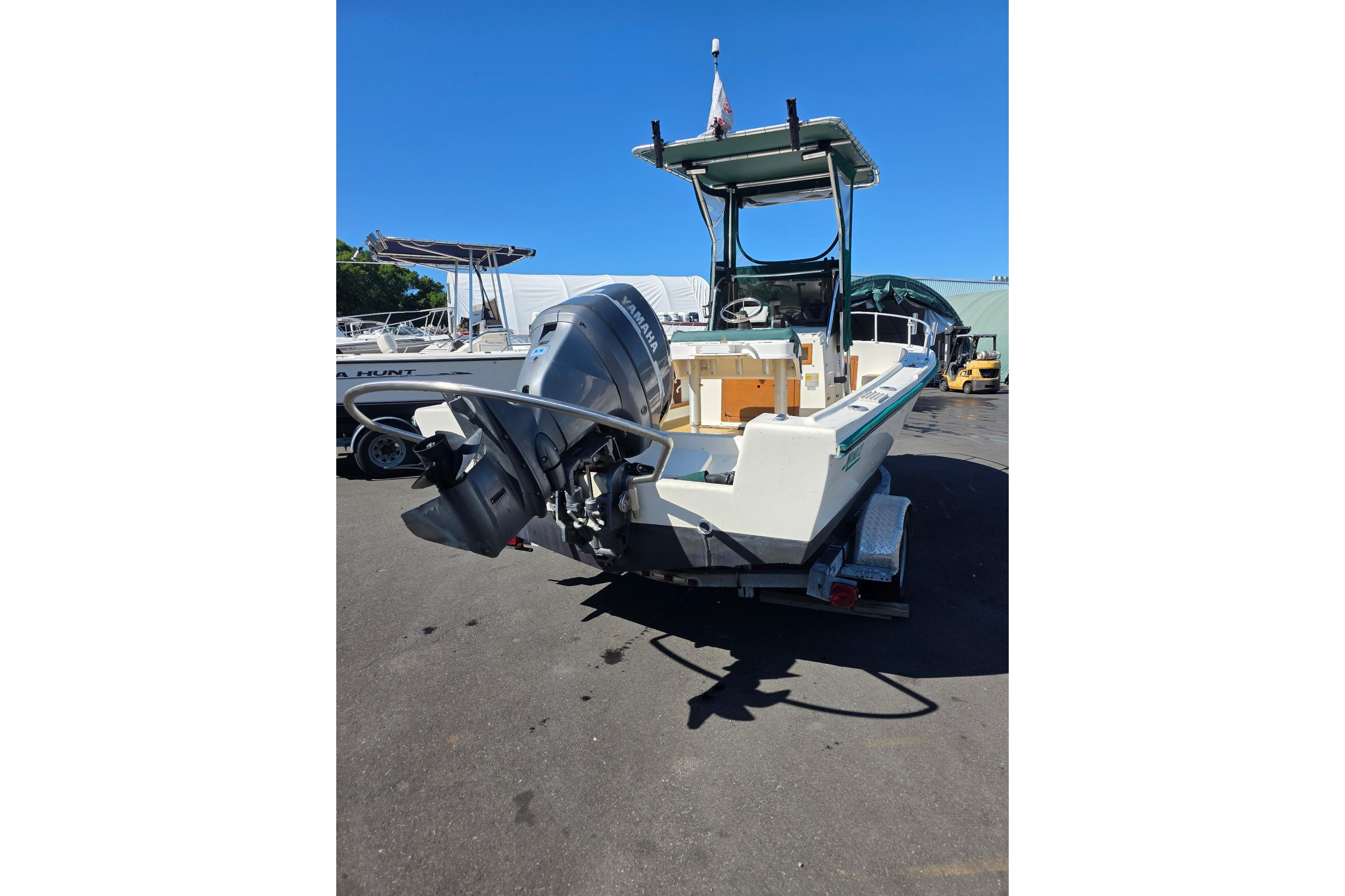 1982 Mako 20 Center Console boat with Yamaha outboard motor on trailer.