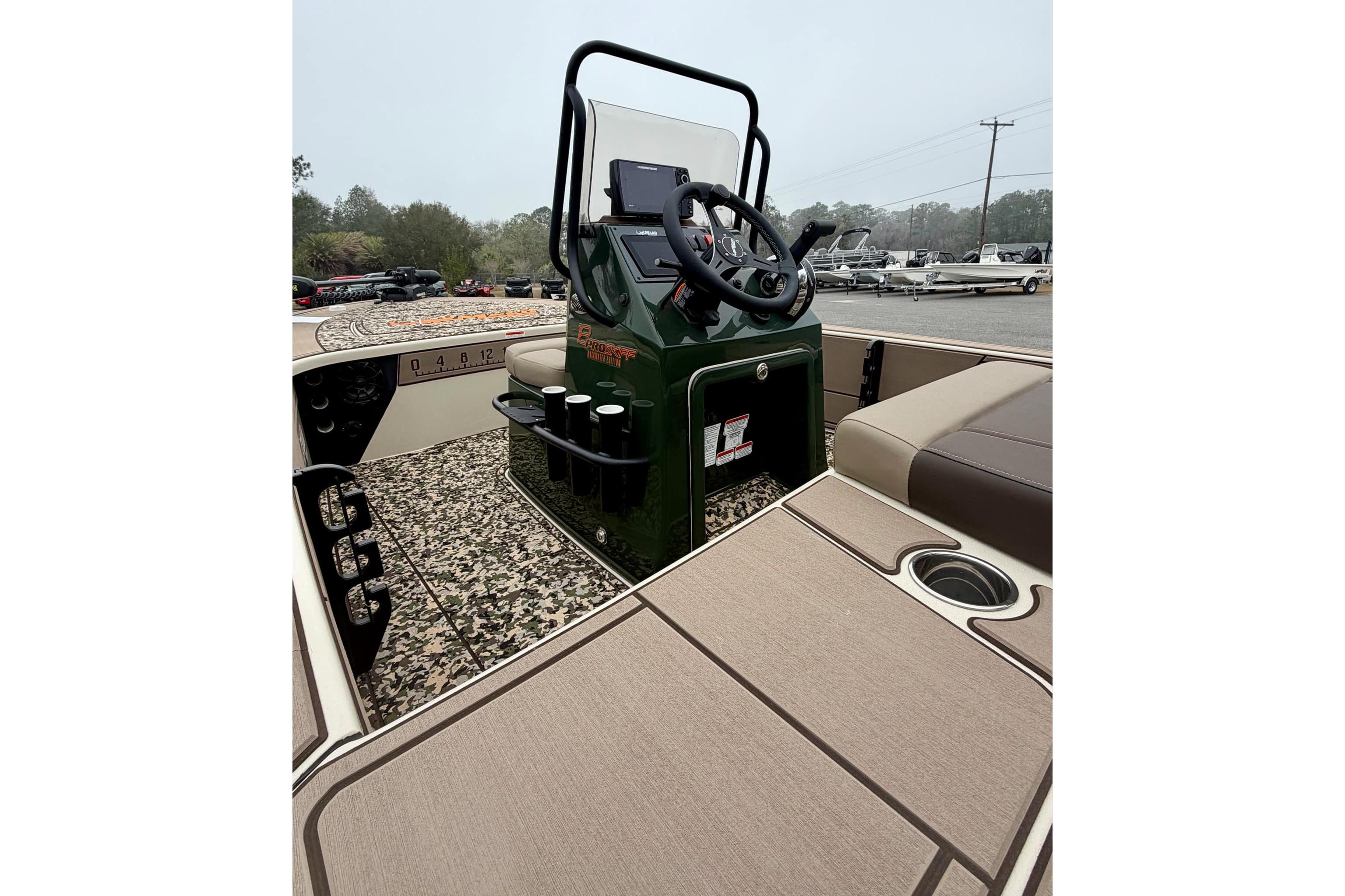 2025 Mako 18 Pro Skiff Backwater Edition boat interior with steering console and seating.