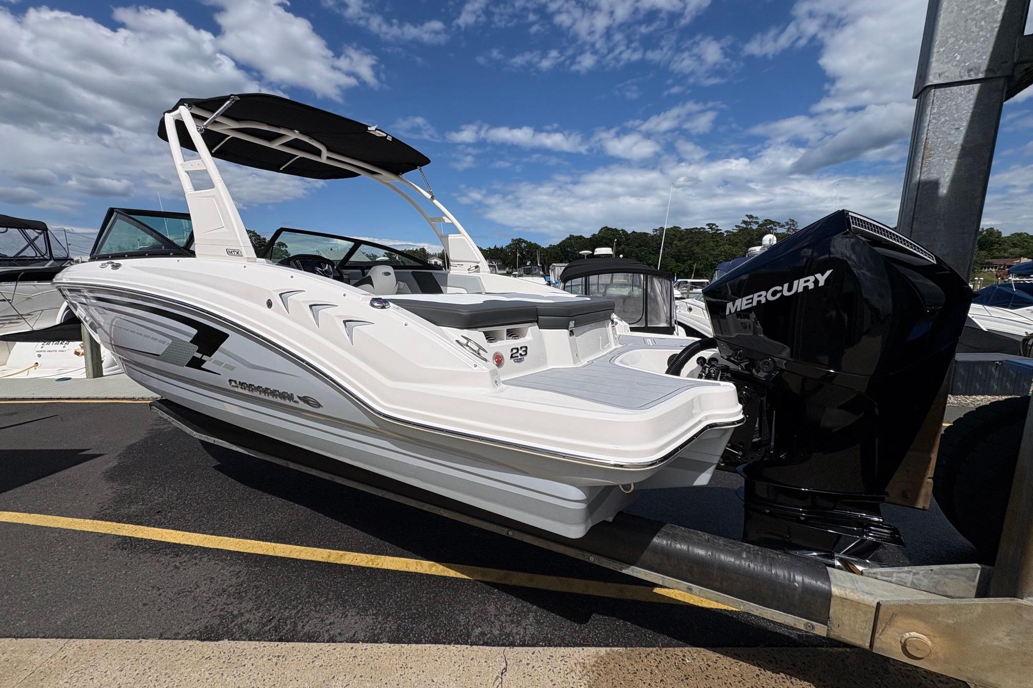 2026 Chaparral 23 SSi OB boat with Mercury outboard engine on a trailer.