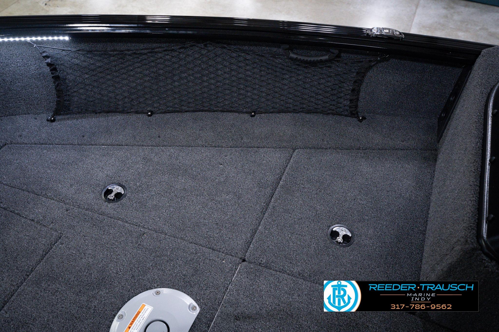 Interior view of 2026 Lund 1875 Impact XS SS boat with carpeted flooring.