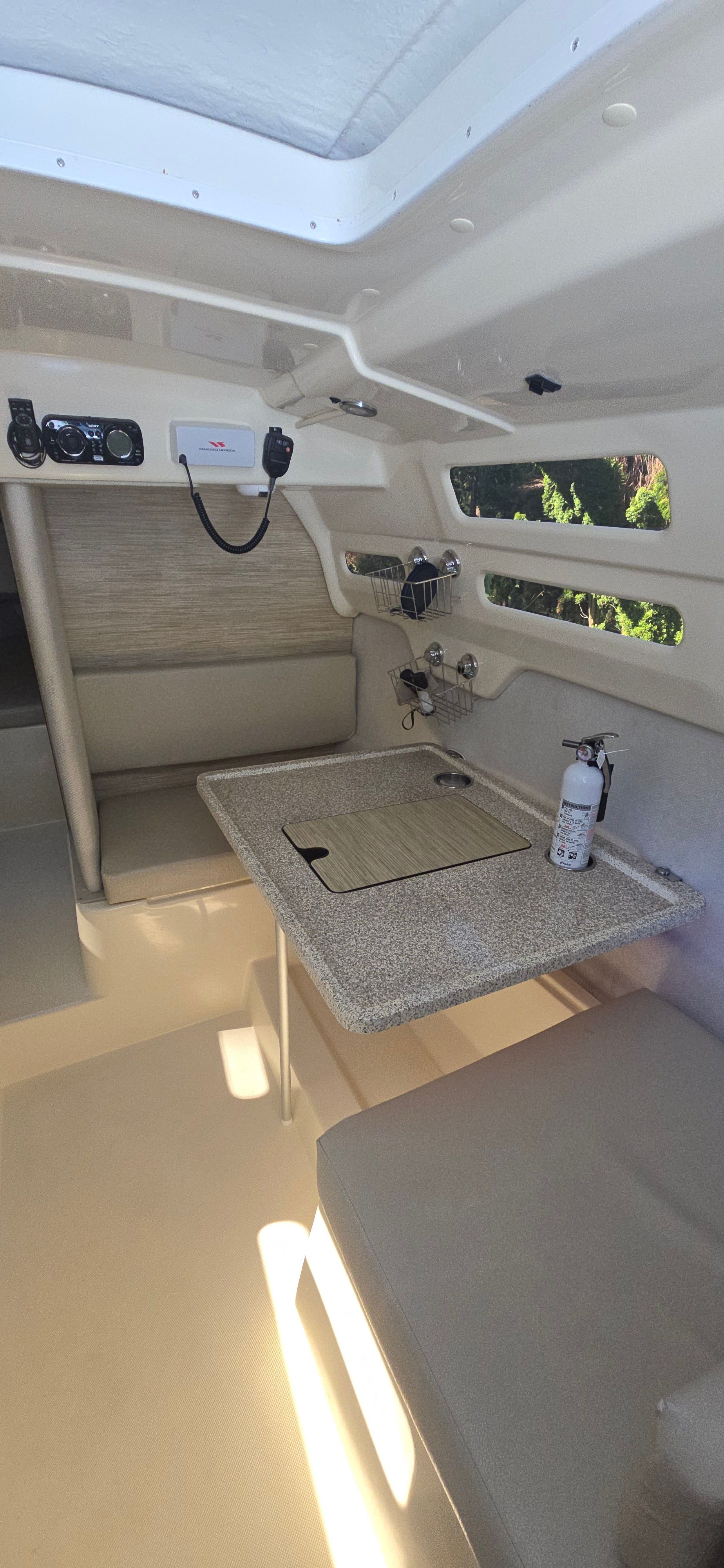 Interior of a 2014 Tattoo 26 with a table and seating area.