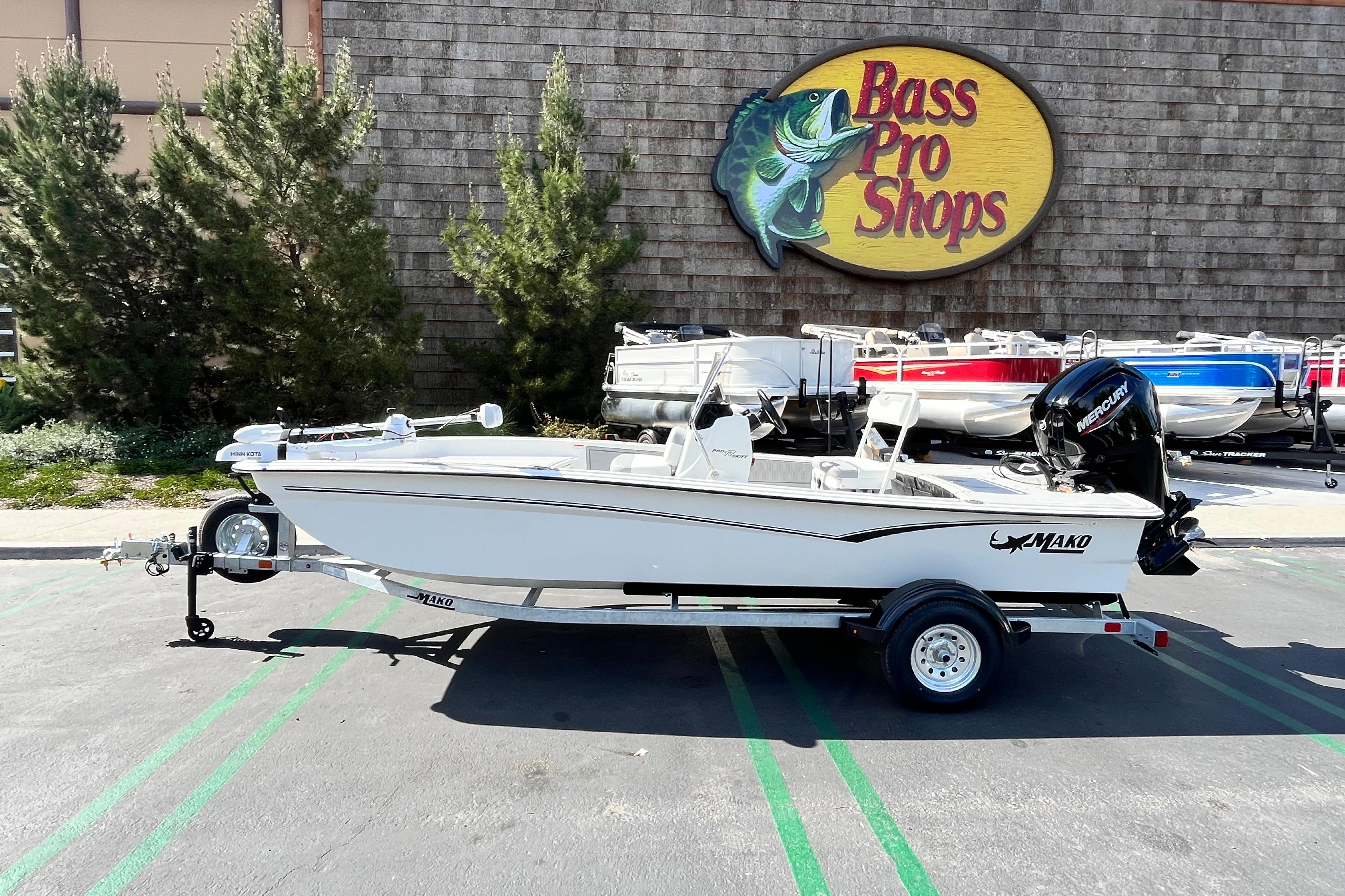 2026 Mako Pro Skiff 17 CC boat displayed at Bass Pro Shops parking lot.
