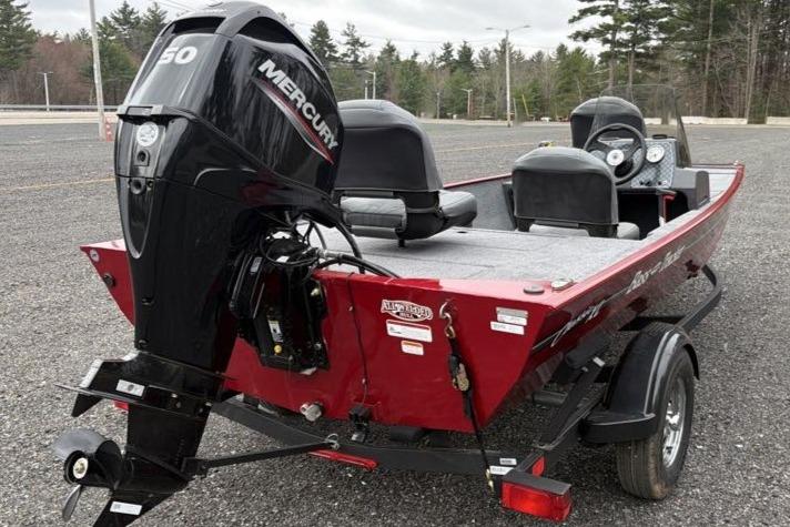 2026 Tracker Bass Tracker Classic XL boat with Mercury engine, parked outdoors.