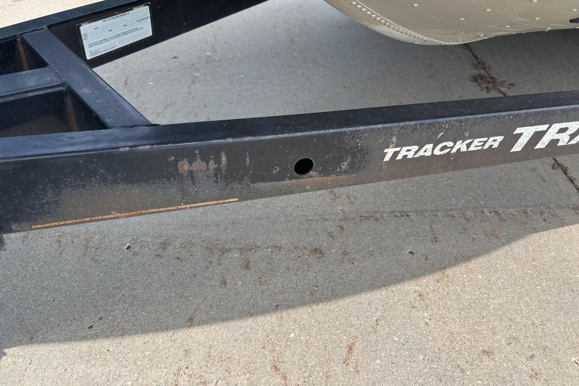 1999 Tracker Targa 18 boat trailer frame on concrete surface.