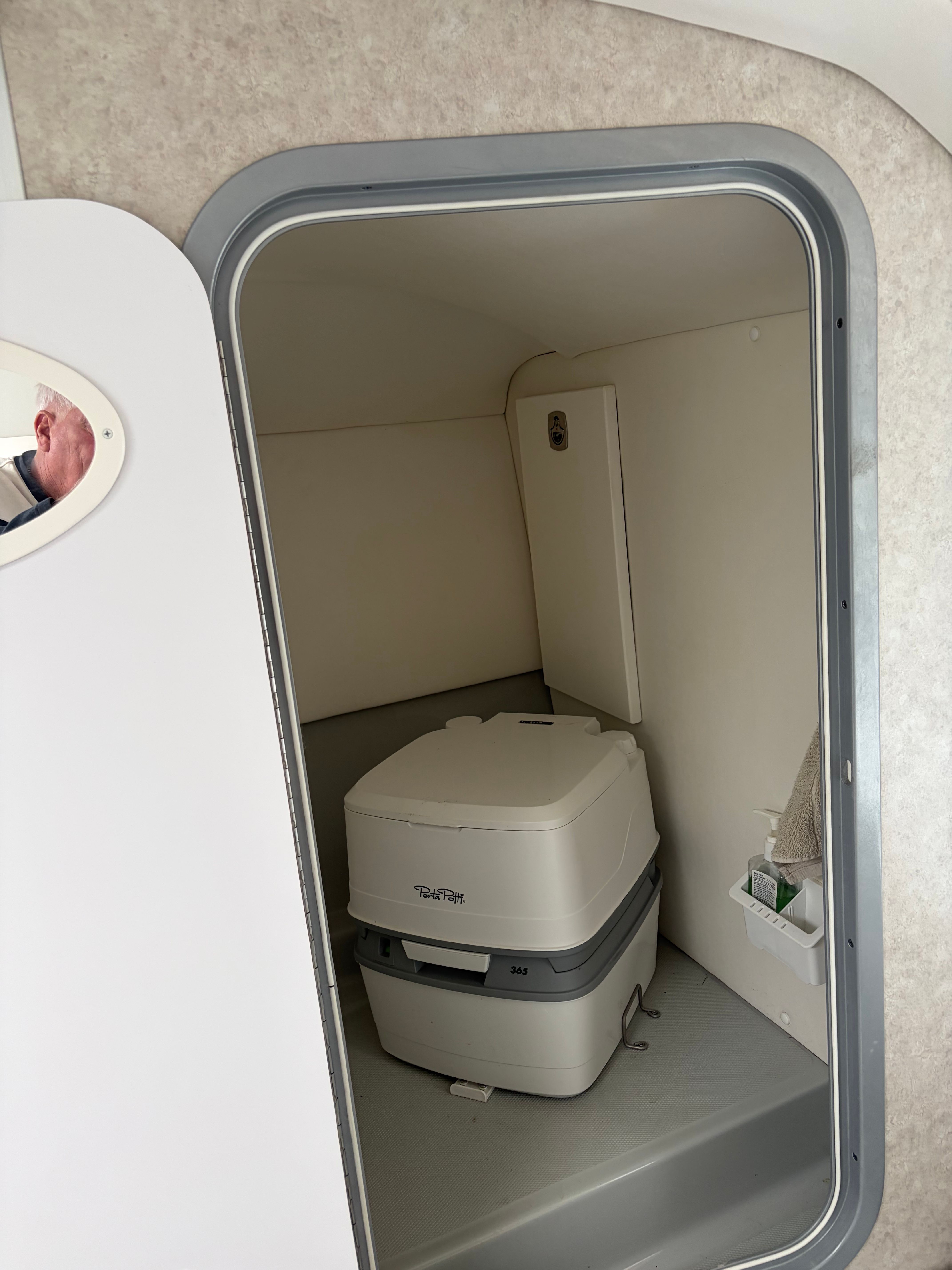 Interior of a 2007 Baja 30 Outlaw with portable toilet.