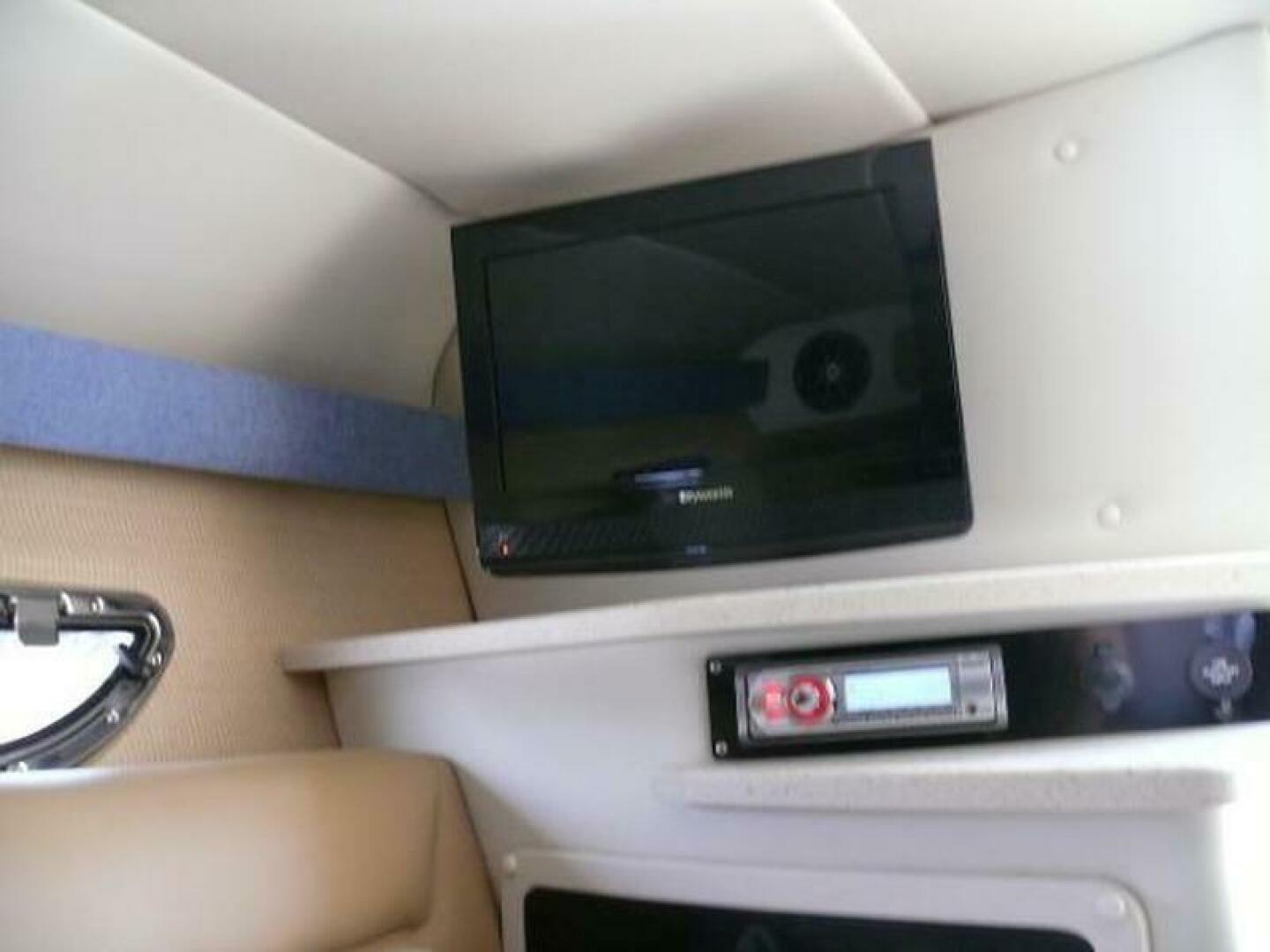 Interior of 2012 Cobalt 273 boat with TV and audio system.