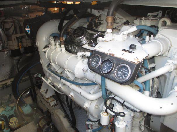 Engine room of 1994 Sea Ray 500 Sundancer with visible gauges and piping.