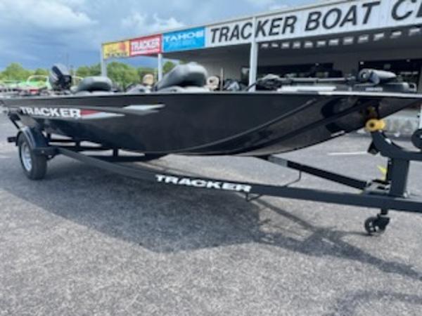 2025 Tracker Panfish 17 boat on trailer at dealership, overcast sky.