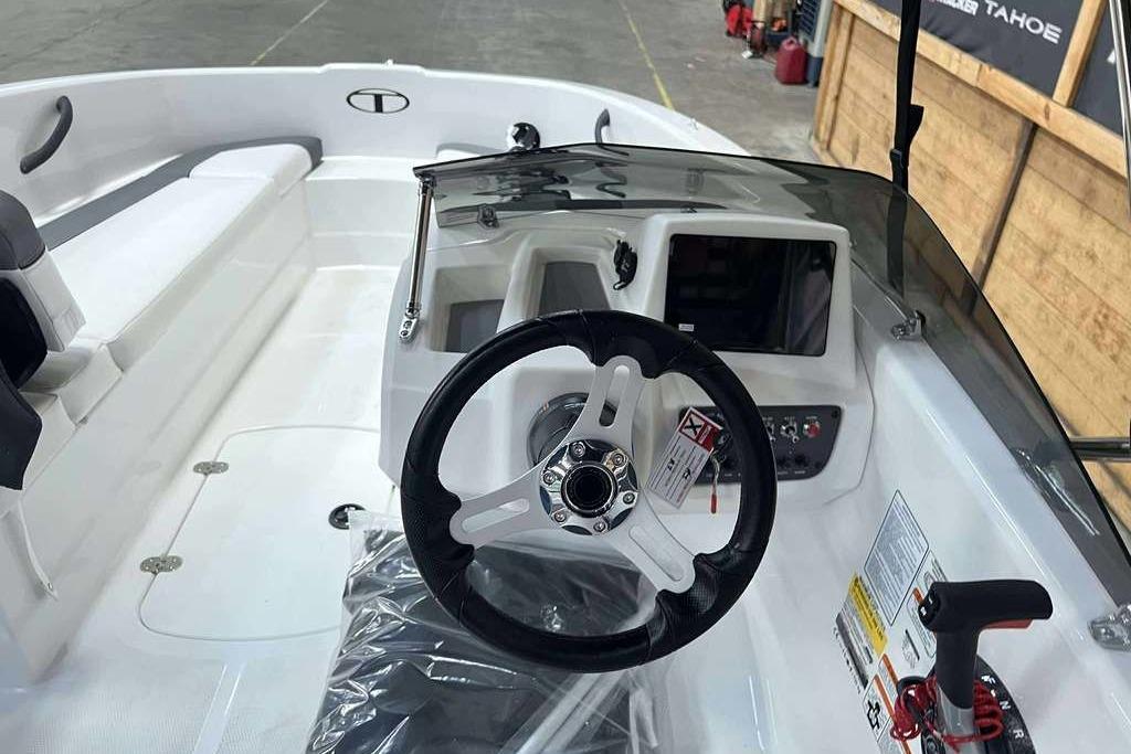 2026 Tahoe T16 boat interior with steering wheel and control panel.