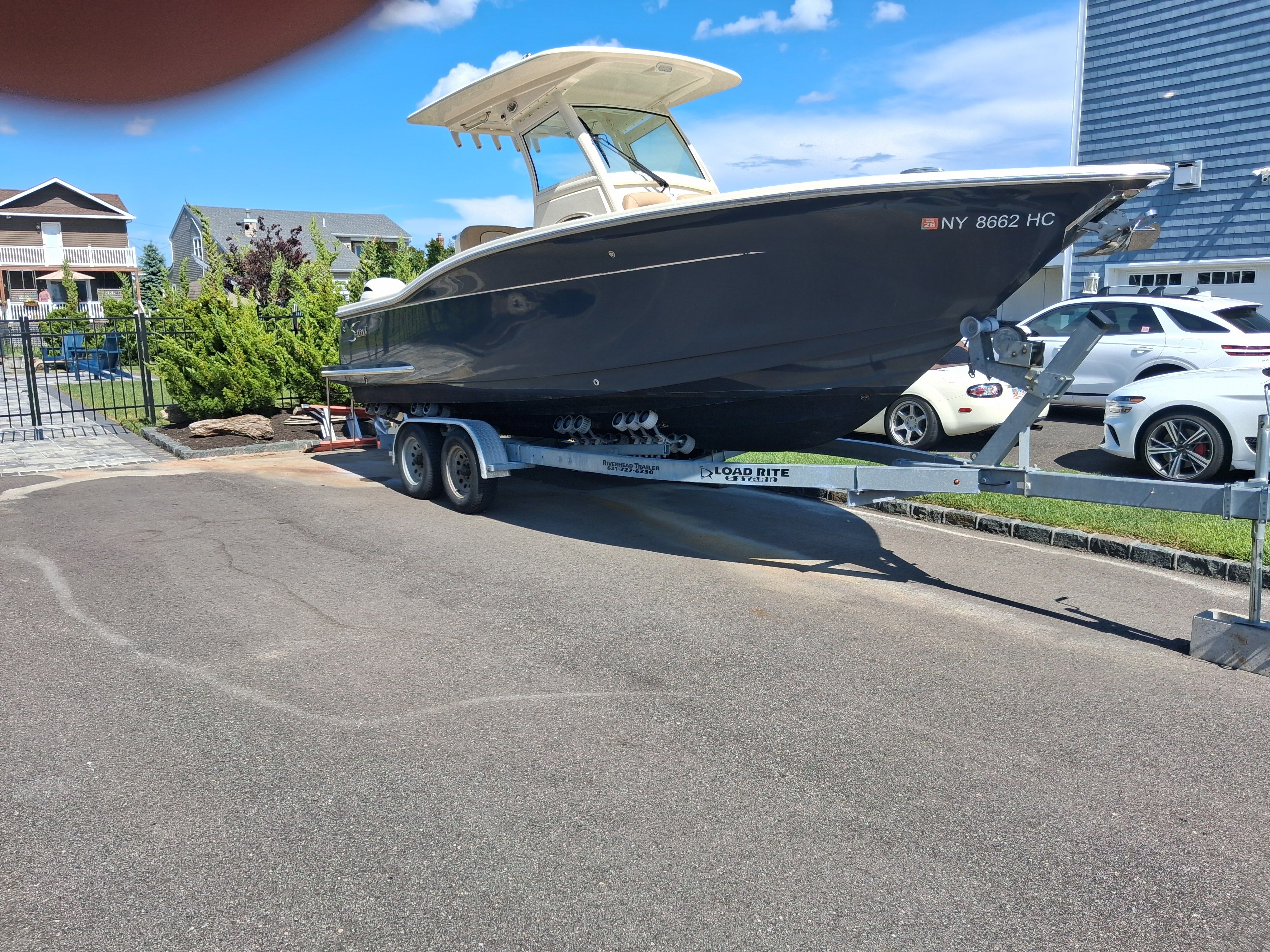 2018 Scout 255LXF boat parked on a trailer.