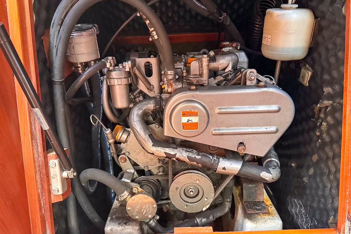 Engine compartment of a 2006 Beneteau 343 sailboat, showcasing mechanical components.