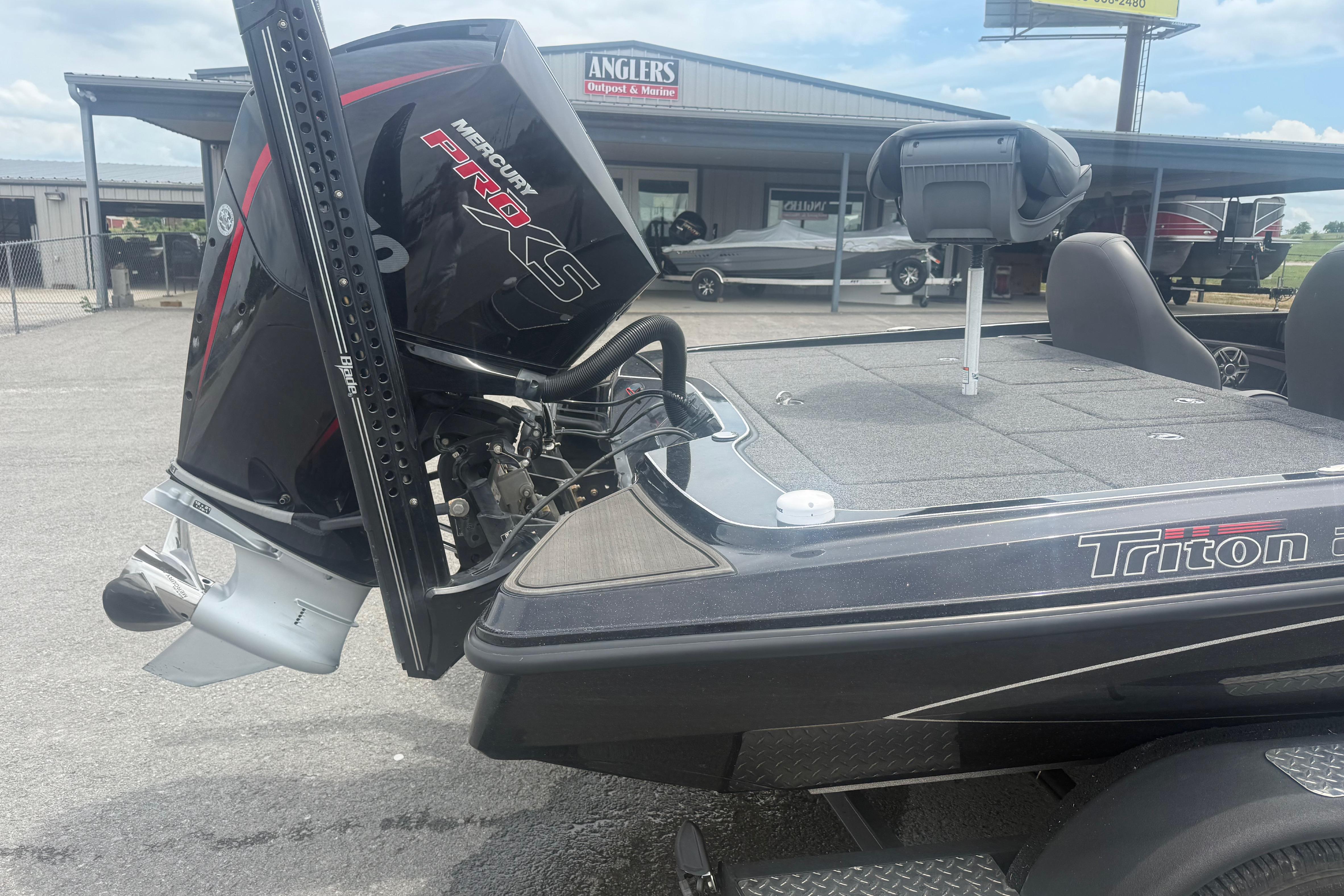 2024 Triton 20XP boat with Mercury Pro XS engine at dealership.