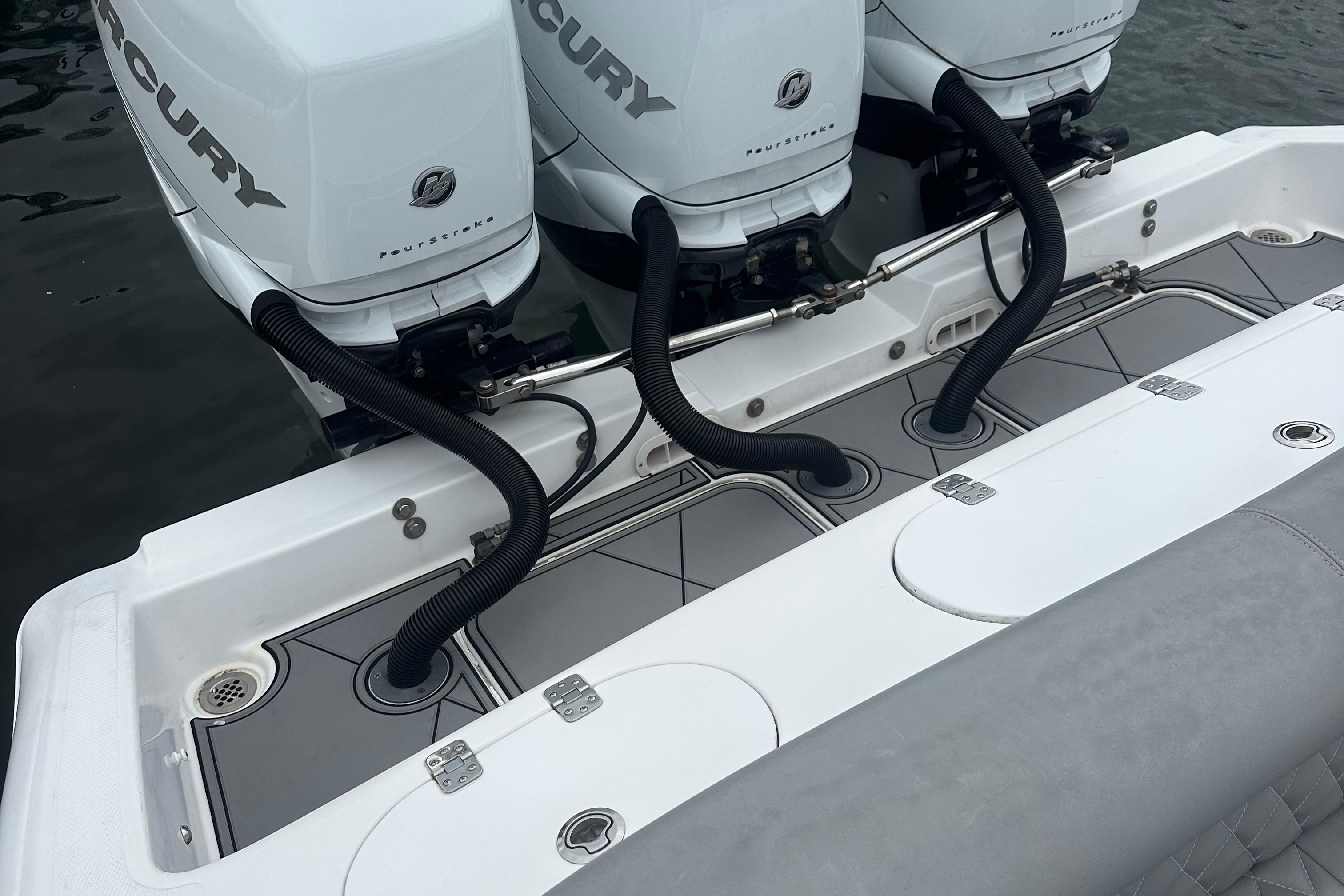 2016 Midnight Express 37 Open boat with triple Mercury outboard engines.
