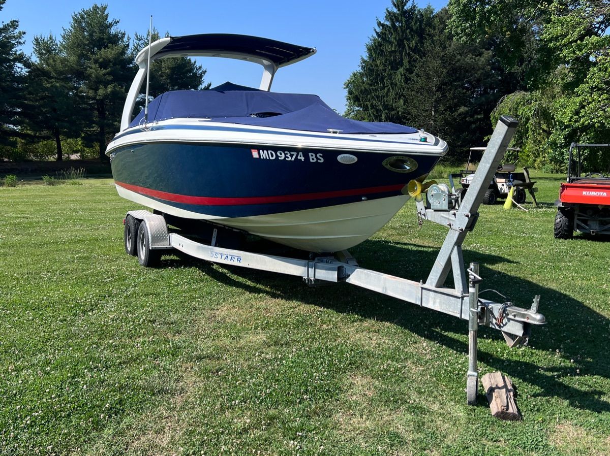 2003 Cobalt Colbalt 262 boat on trailer outdoors.