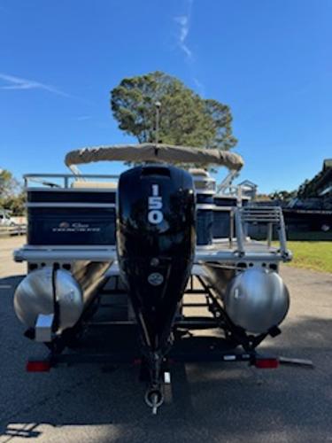 2025 Sun Tracker Fishin' Barge 22 DLX with 150 HP outboard motor.
