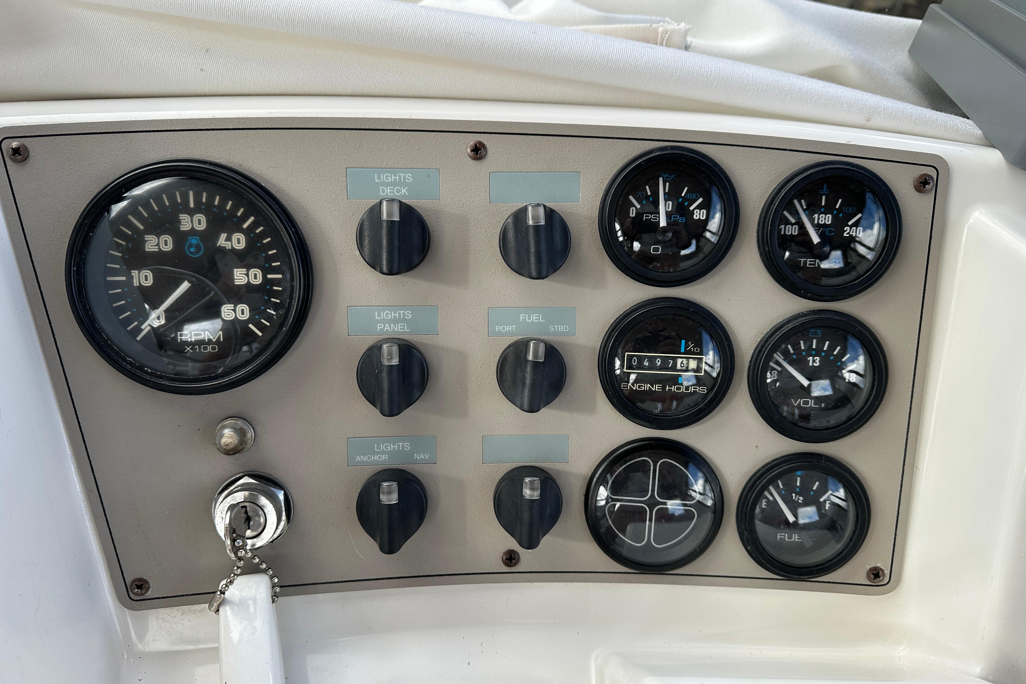 Control panel of a 1997 Carver 325 Motor Yacht with gauges and switches.