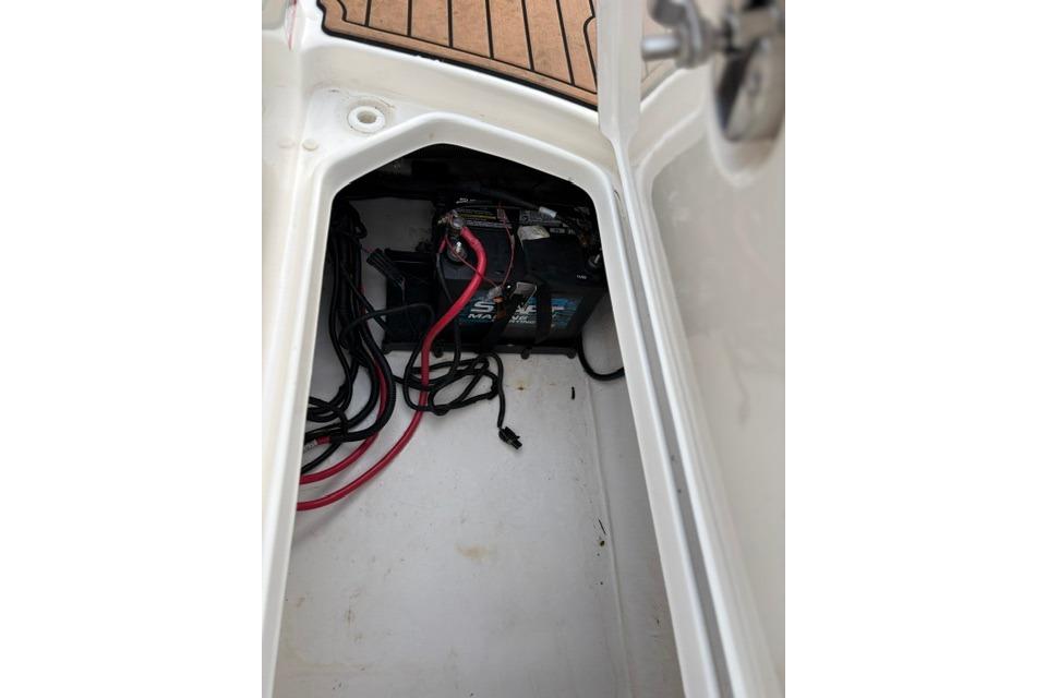 2017 Searay SPX210 boat battery compartment with cables and wiring.