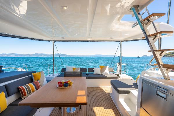Luxurious Lagoon 43 yacht interior, 2025 model, featuring elegant seating and ocean views.