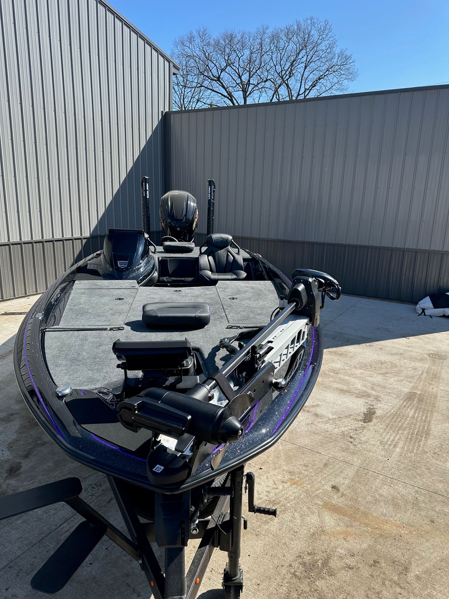 2024 Skeeter ZXR21 boat on concrete surface near building.