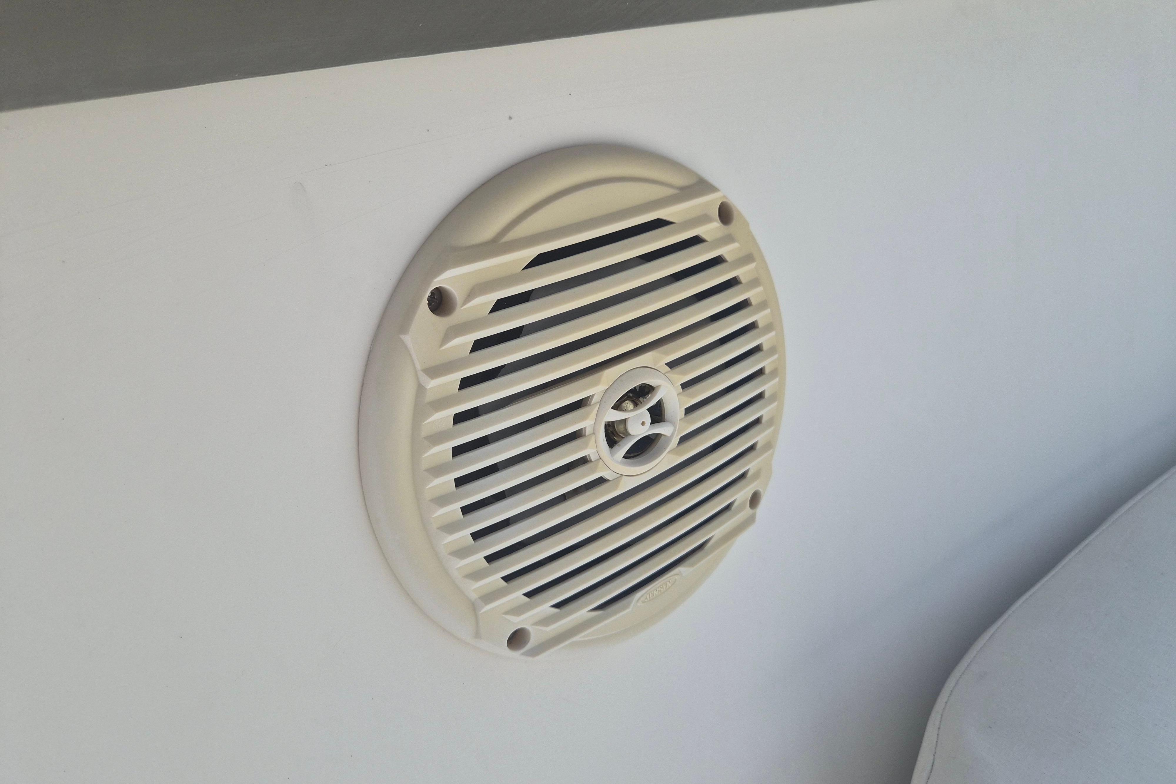 Boat speaker on a 2006 Century 2900 Center Console, mounted on a white surface.