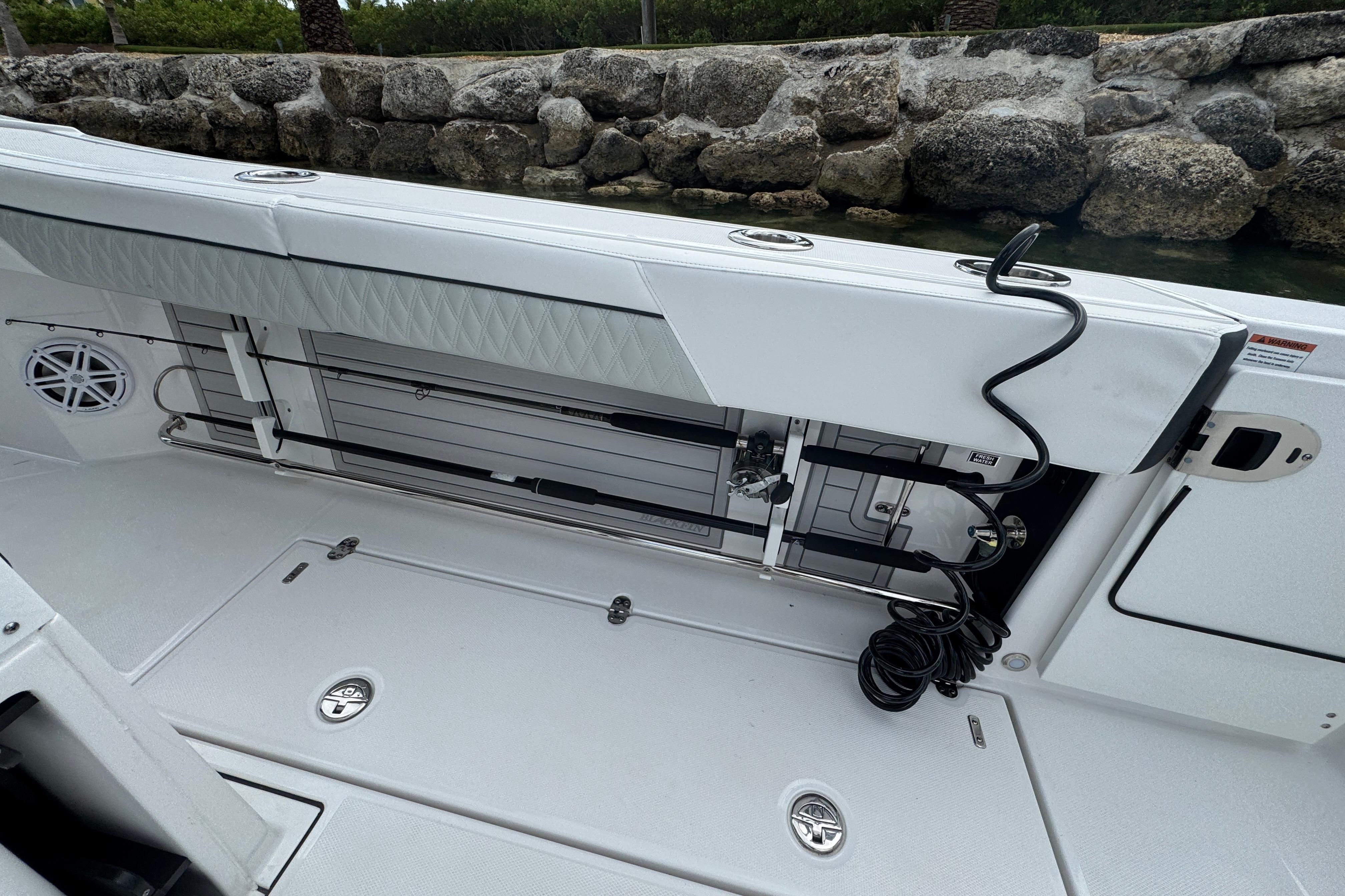 2024 Blackfin 332 CC boat interior with storage and seating features.