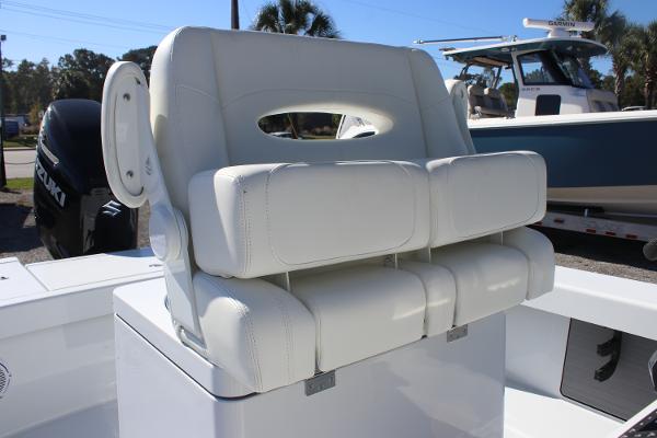 White cushioned seating on 2025 East Cape 25 Open boat, with background of other boats.
