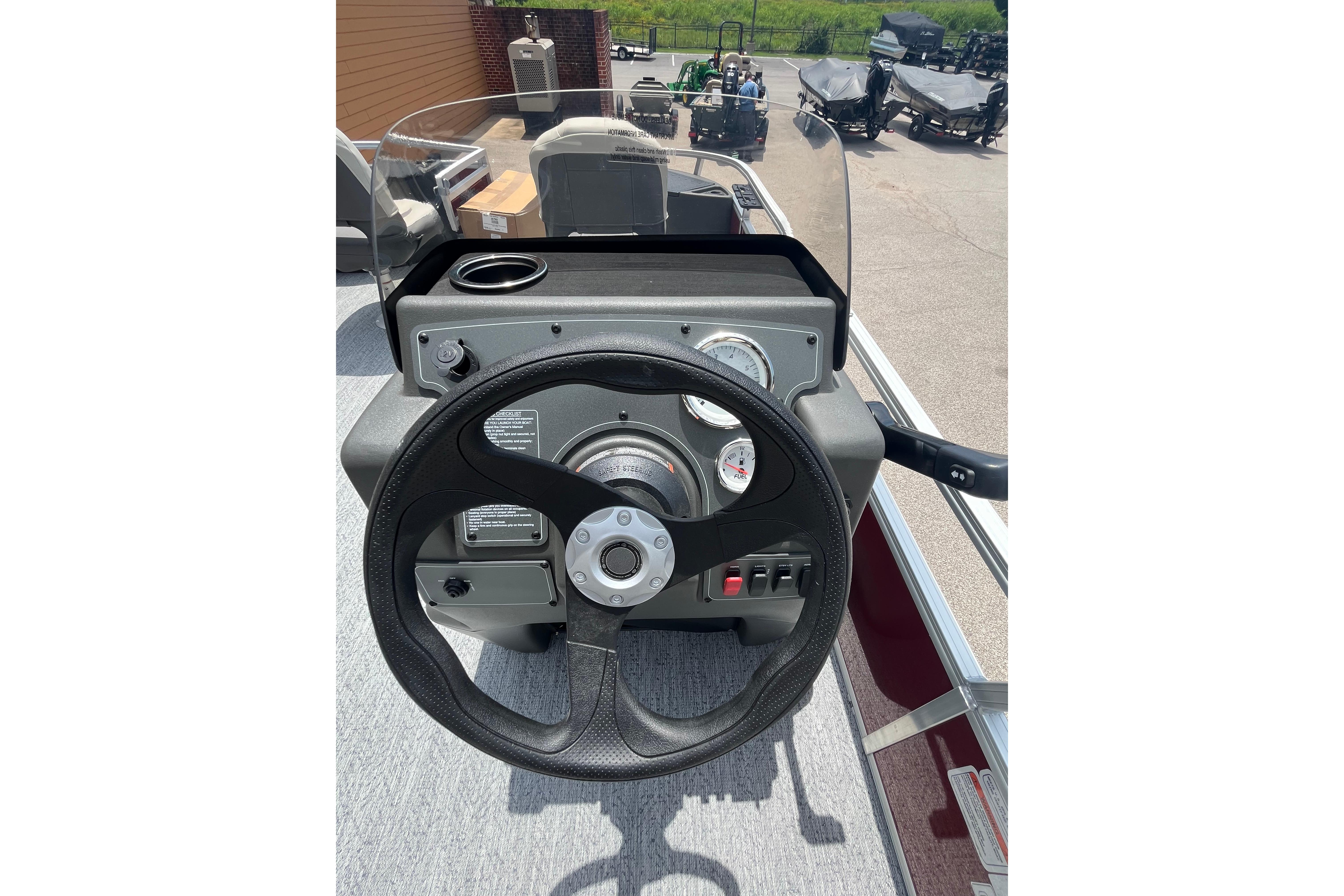 2026 Sun Tracker Bass Buggy 18 DLX steering console with gauges and controls.