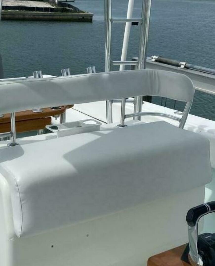 2012 Contender 39ST boat seating area with white upholstery and chrome accents.