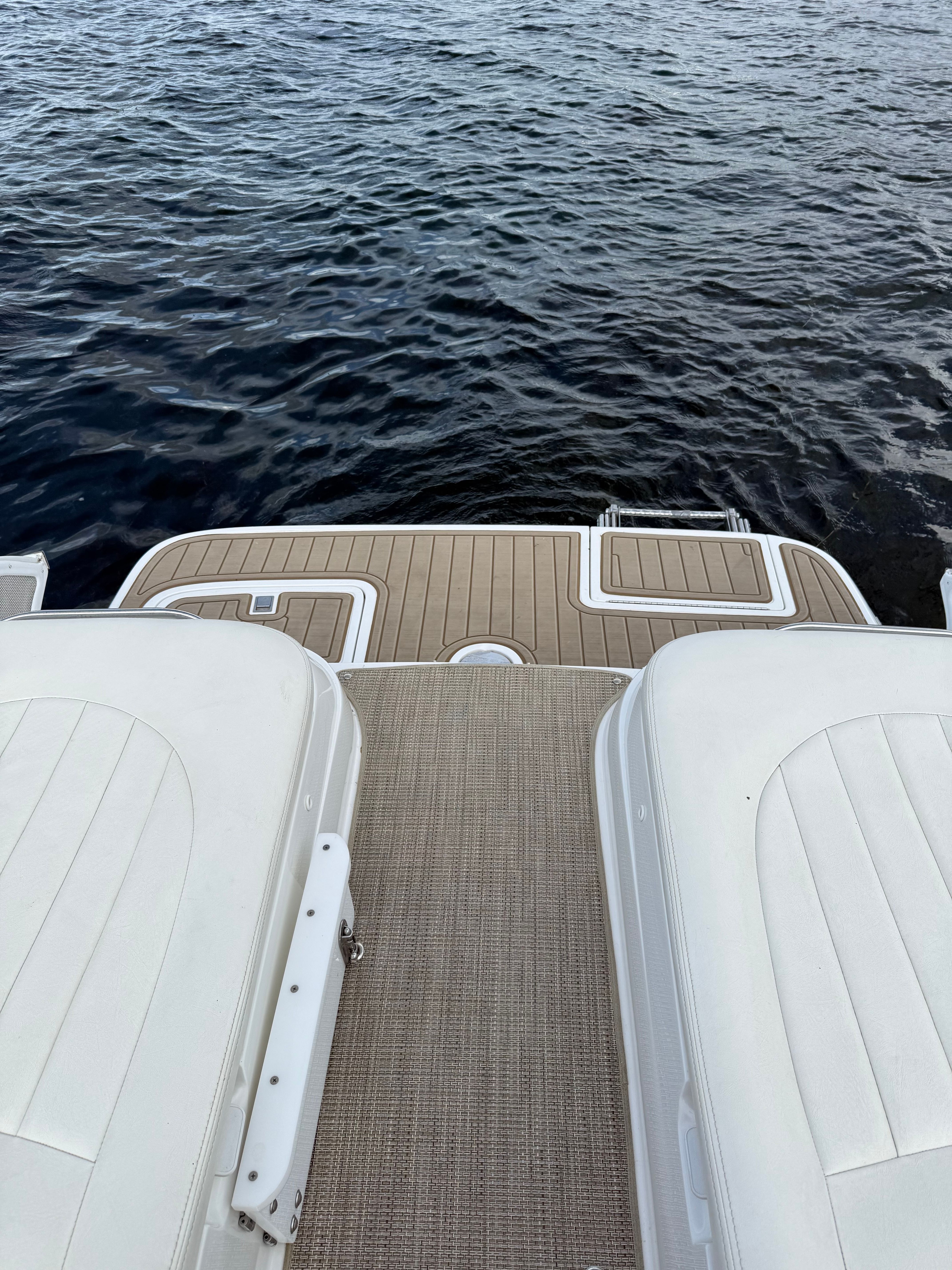 2003 Cobalt 262 boat on calm water.
