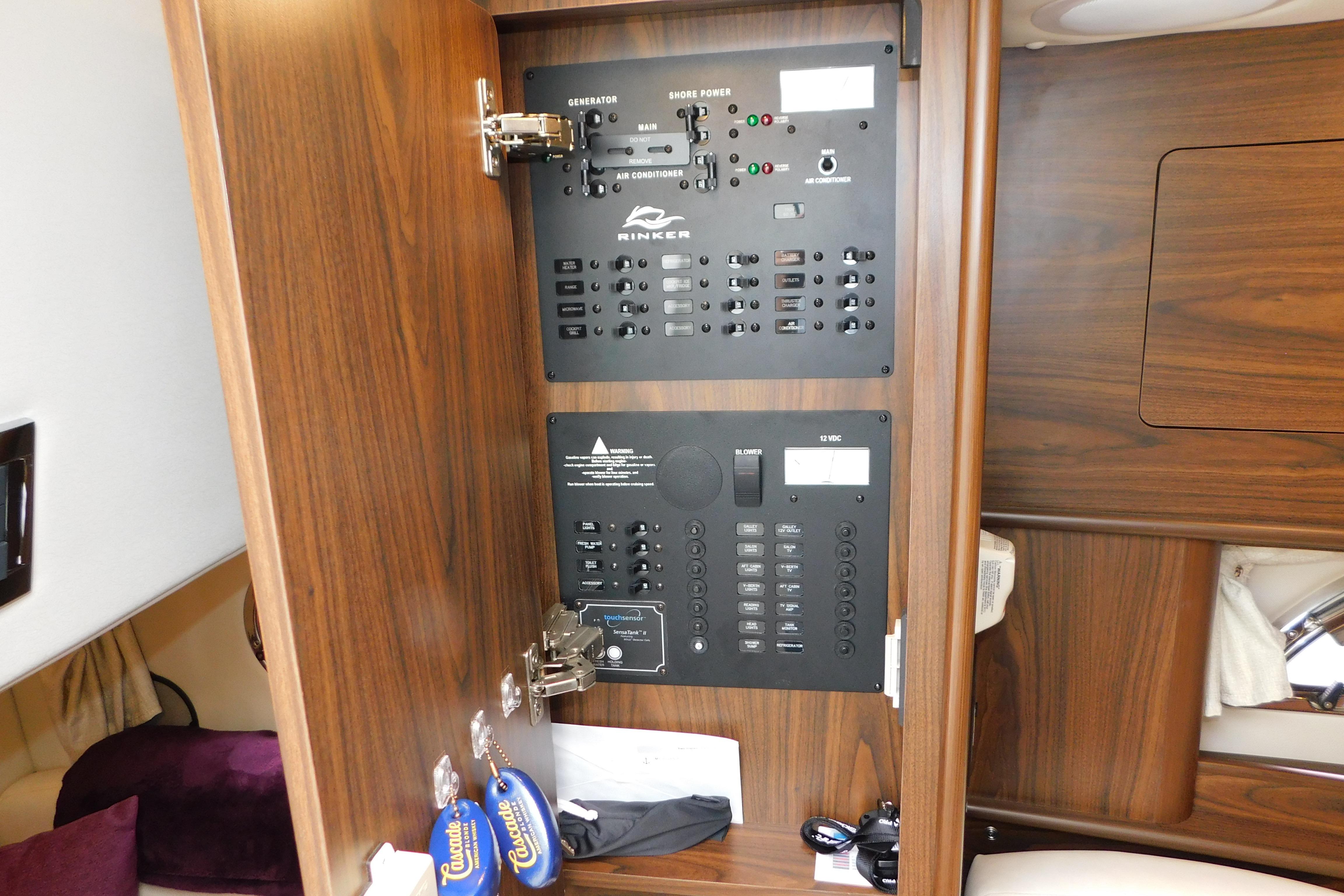 Electrical control panel inside 2017 Rinker EX 320 boat, featuring switches and indicators.