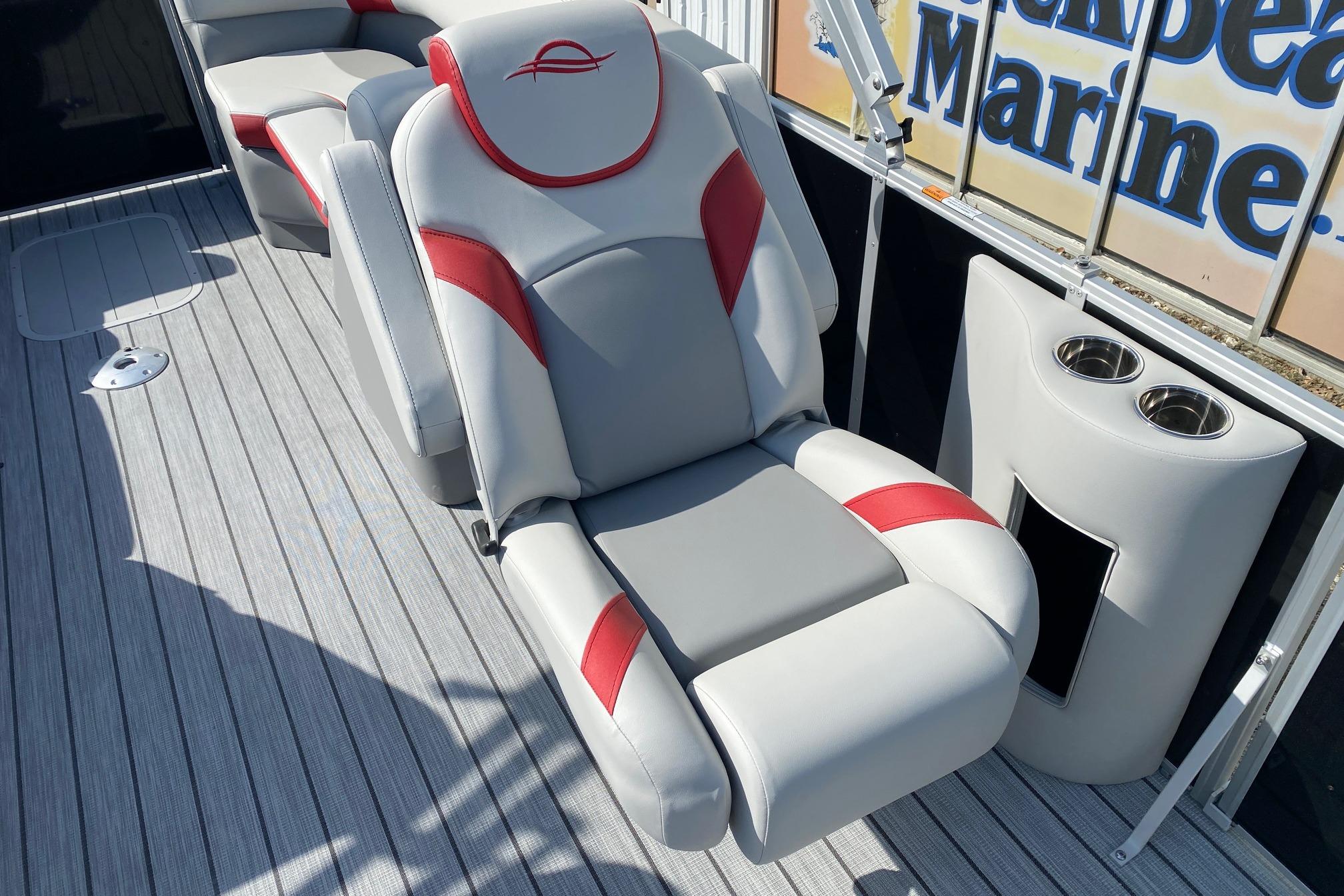 Luxurious seating on 2026 SunCatcher Select 322RC pontoon boat with cup holders and stylish design.