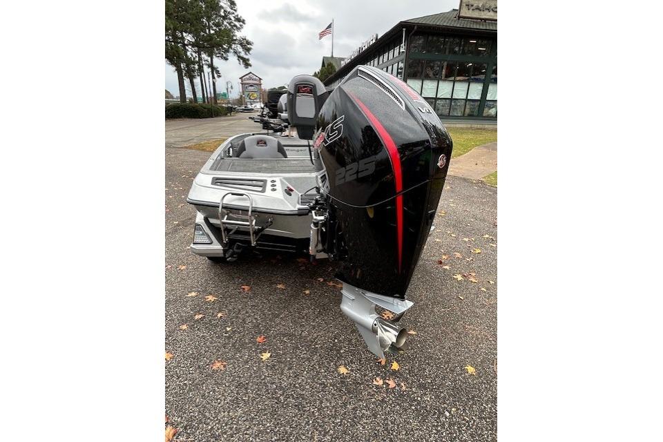 2024 Ranger Z519 Ranger Cup Equipped boat with powerful 225 engine, parked outdoors.