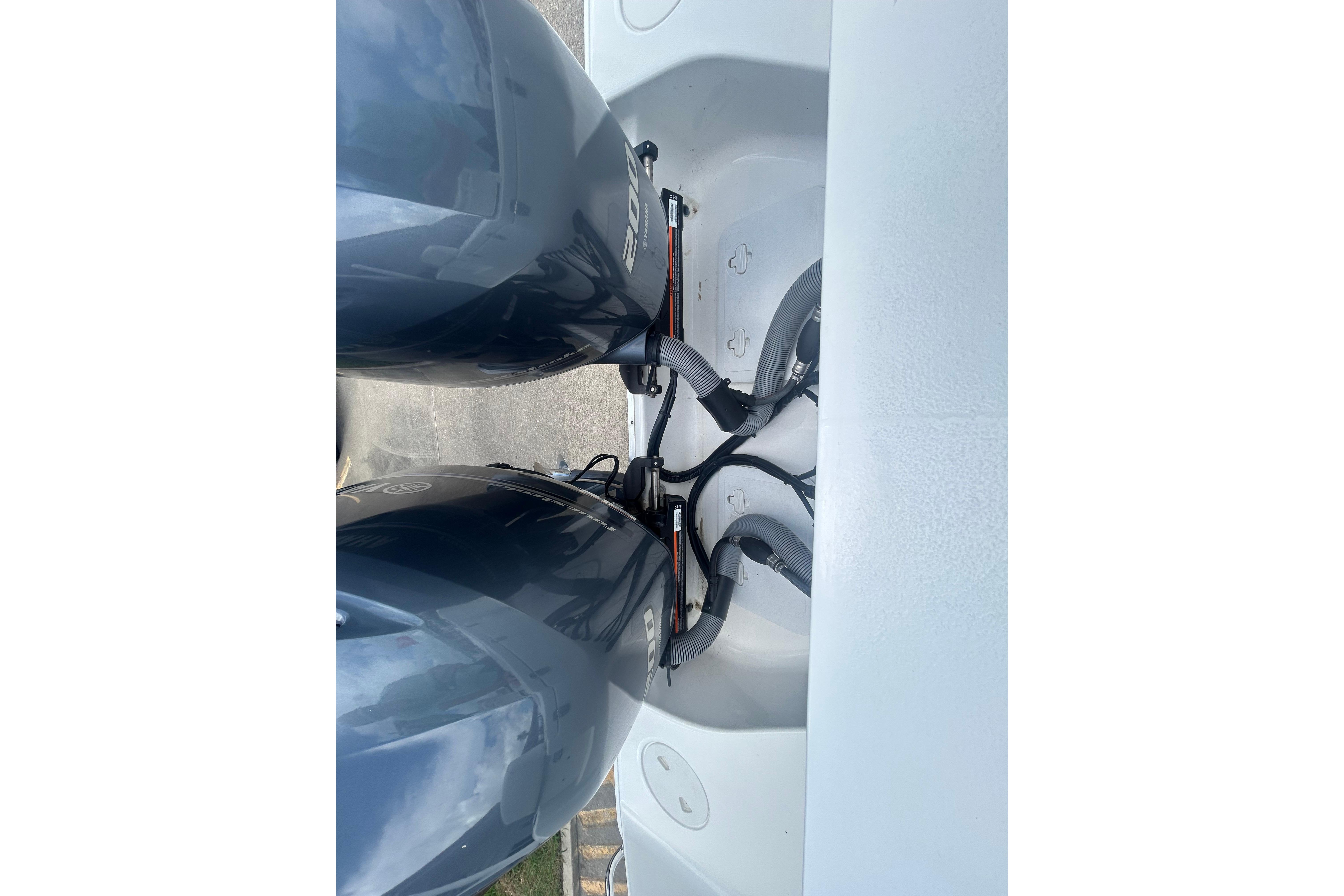 Twin outboard motors on a 2023 Sea Hunt Gamefish 27 Coffin Box boat.