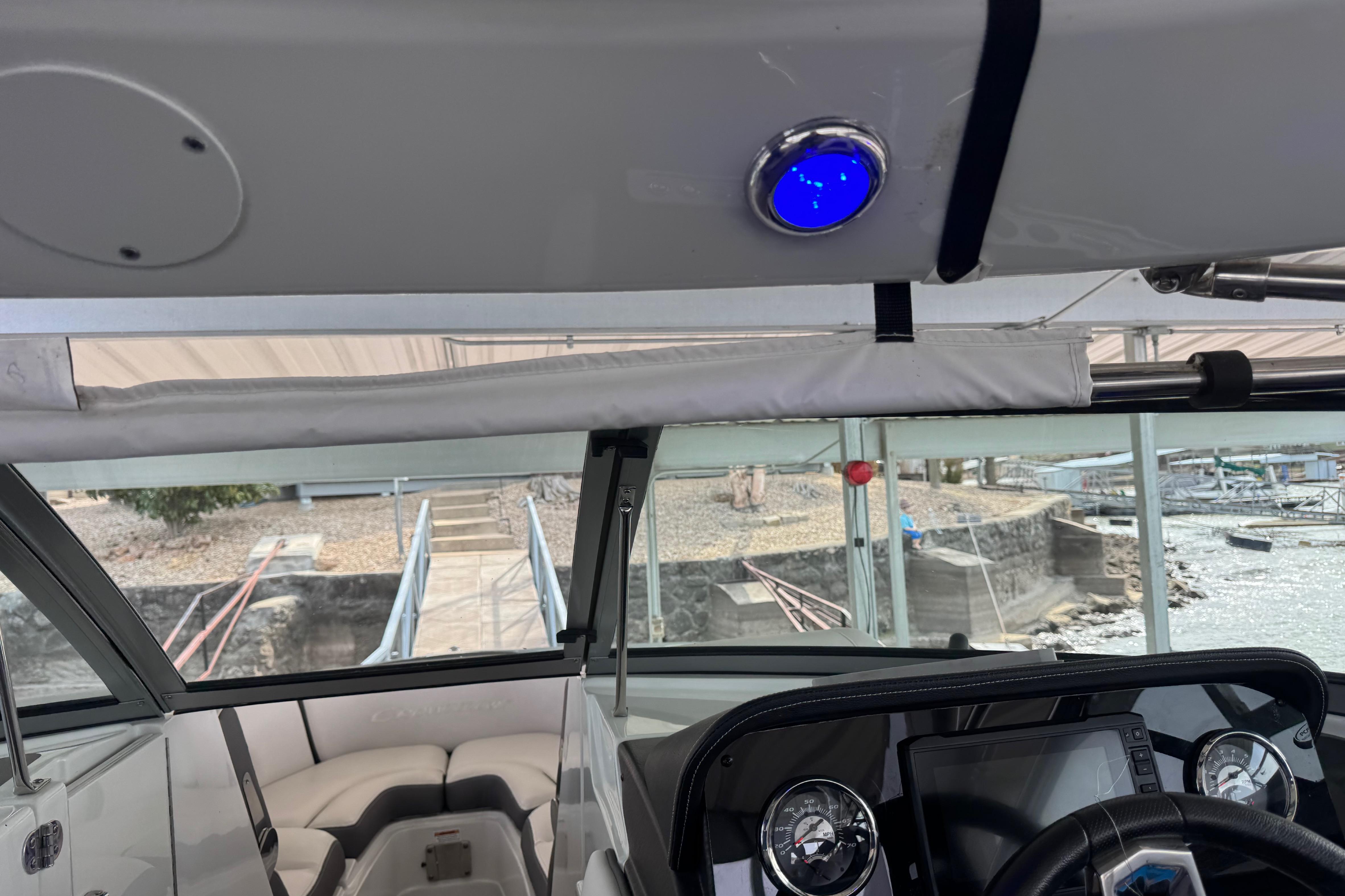 Interior view of 2022 Crownline 265 SS boat with dashboard and seating.