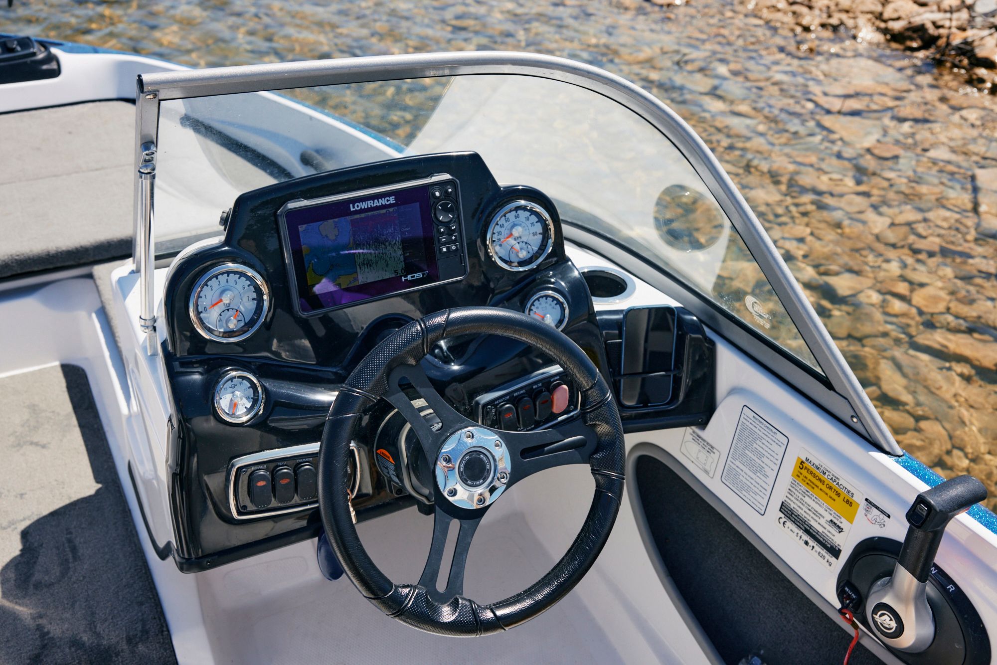 Dashboard of a 2020 Nitro Z19 Sport boat by the water.