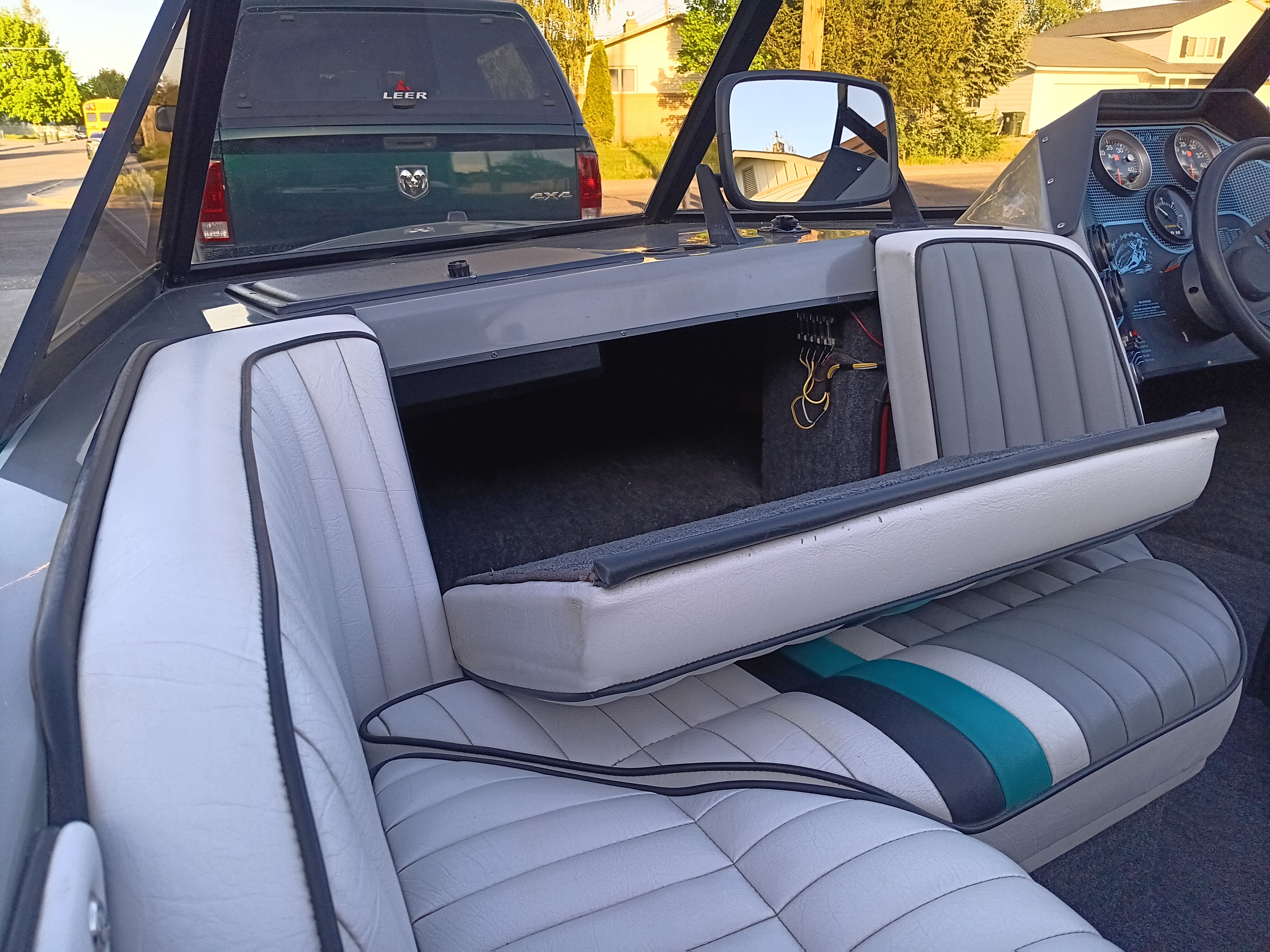 Interior of a 1991 Malibu Skier boat with white seats.