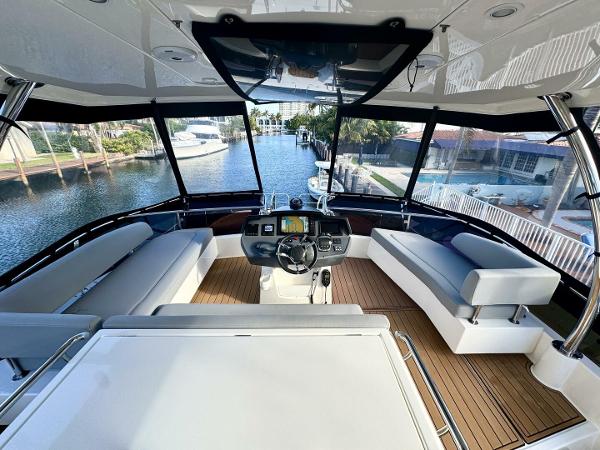 Interior view of 2022 Aquila 44 yacht with modern helm and seating area.