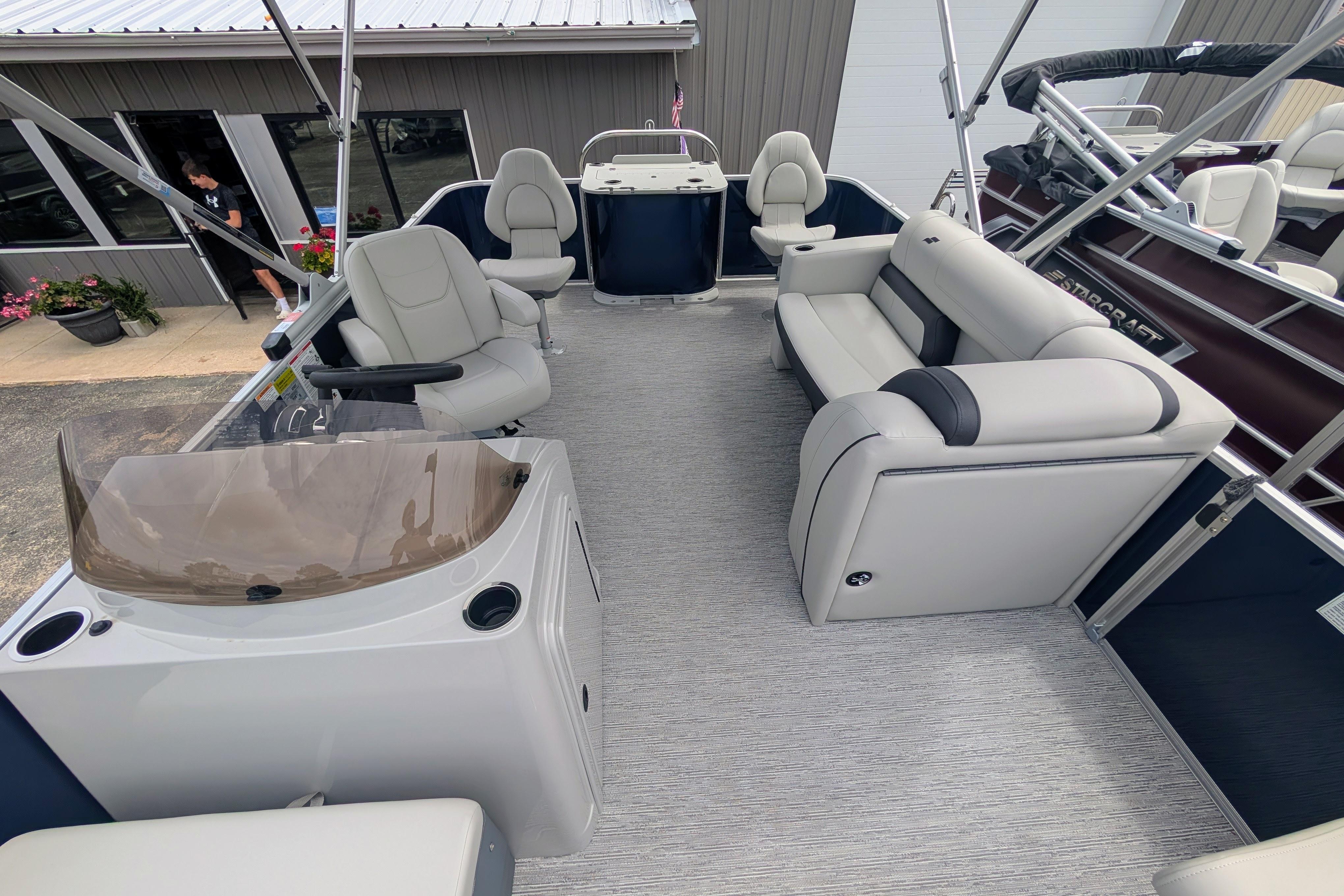 2026 Starcraft EX 20 F pontoon boat interior with plush seating and modern helm.