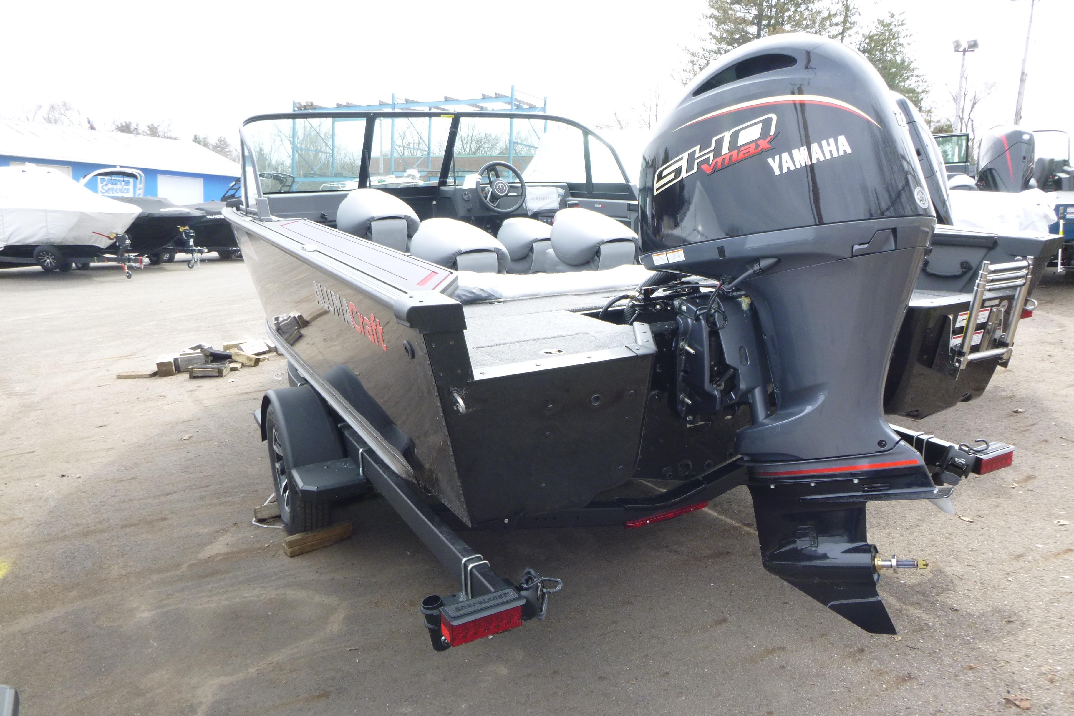 2025 Alumacraft Trophy 185X Sport boat with Yamaha outboard motor, parked on a trailer.