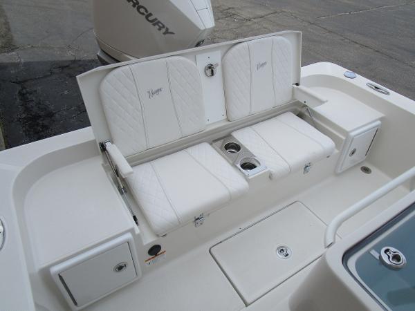 2024 Ranger 2360 Bay boat with white cushioned seating and storage compartments.