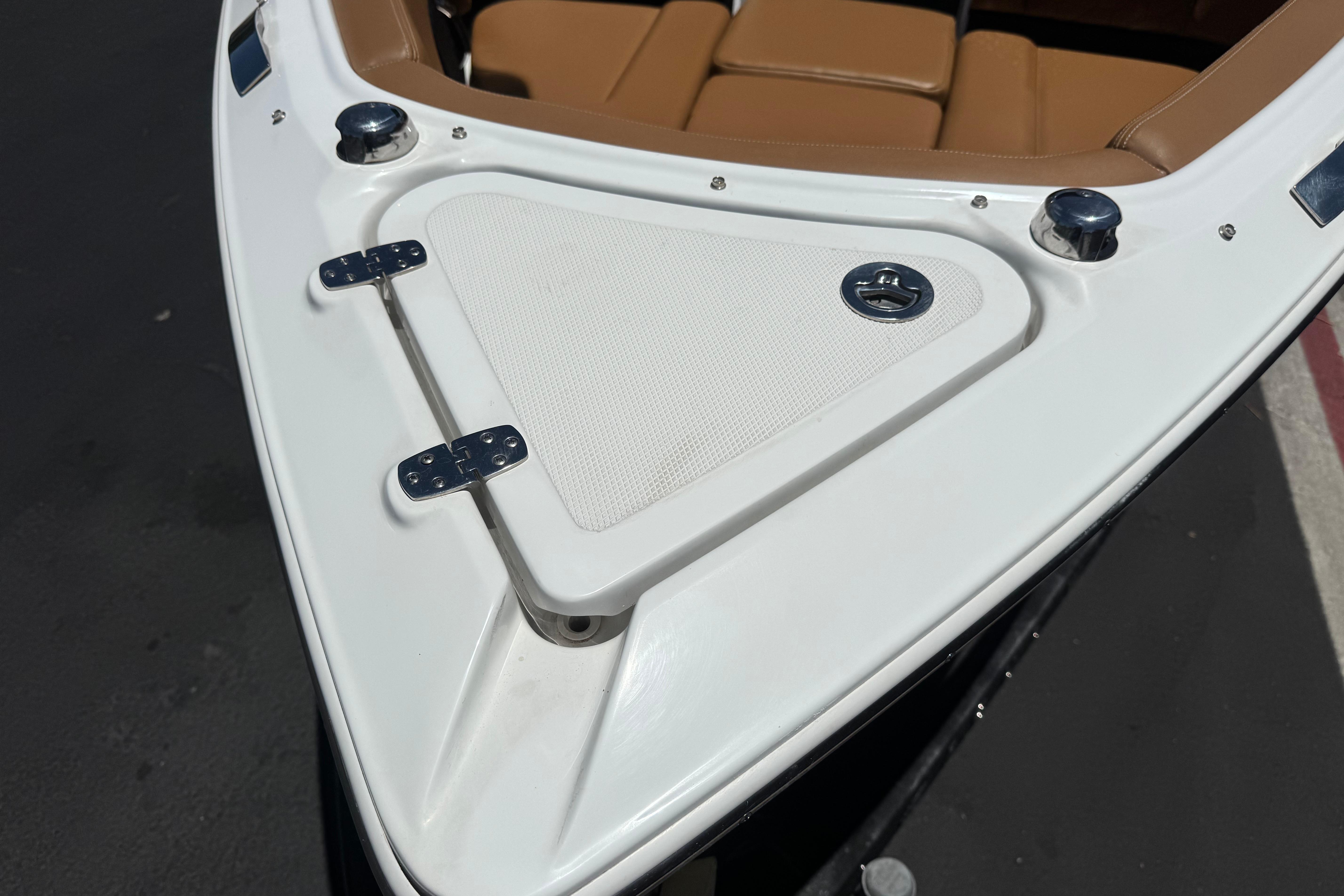 Bow of 2022 Four Winns H4 boat with tan seating and white deck.