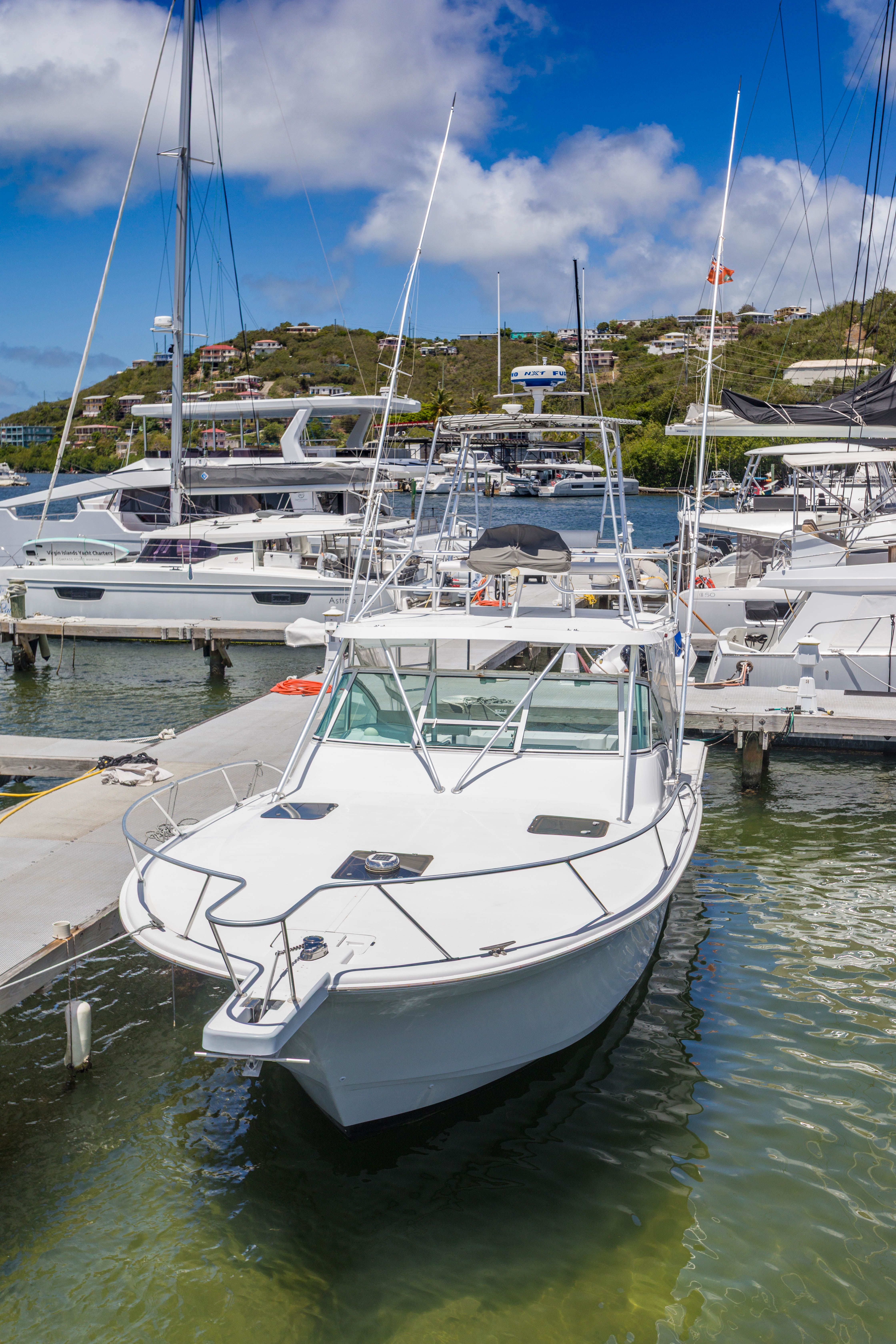 1999 Luhrs Tournament 360 Convertible docked on a sunny day.