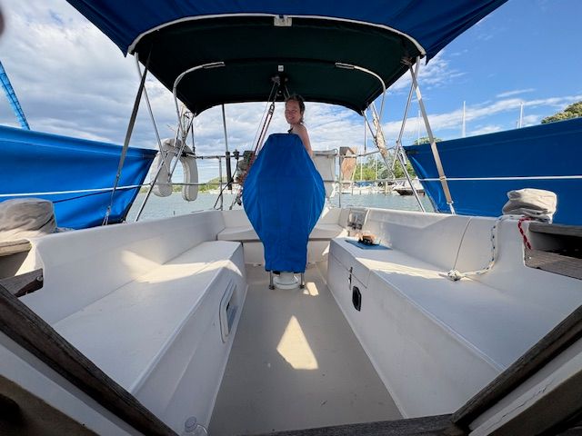 Interior view of a 1988 Catalina Mark II yacht with blue covers.