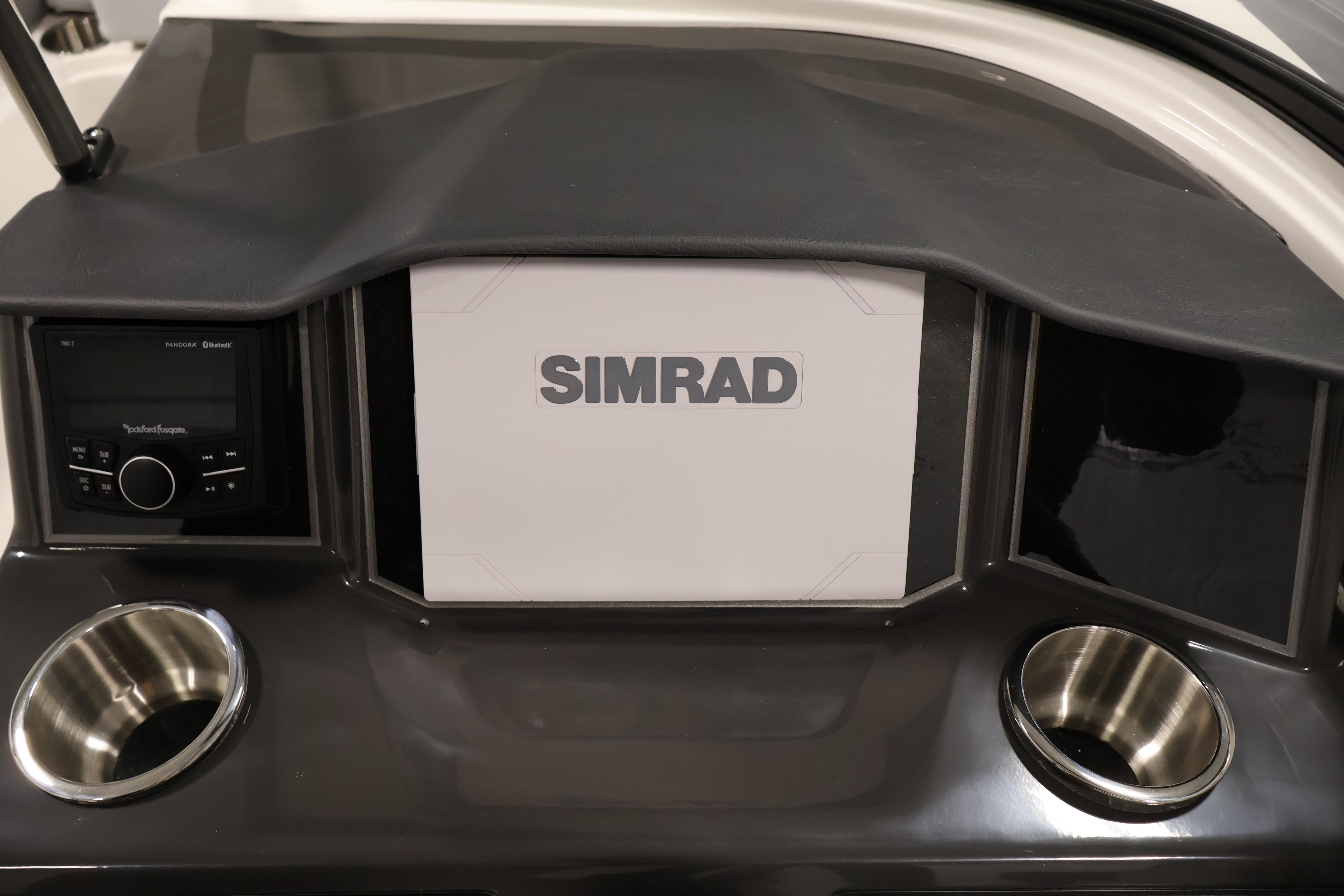 Dashboard of 2026 Bayliner VR6 Bowrider I/O with Simrad display and cup holders.